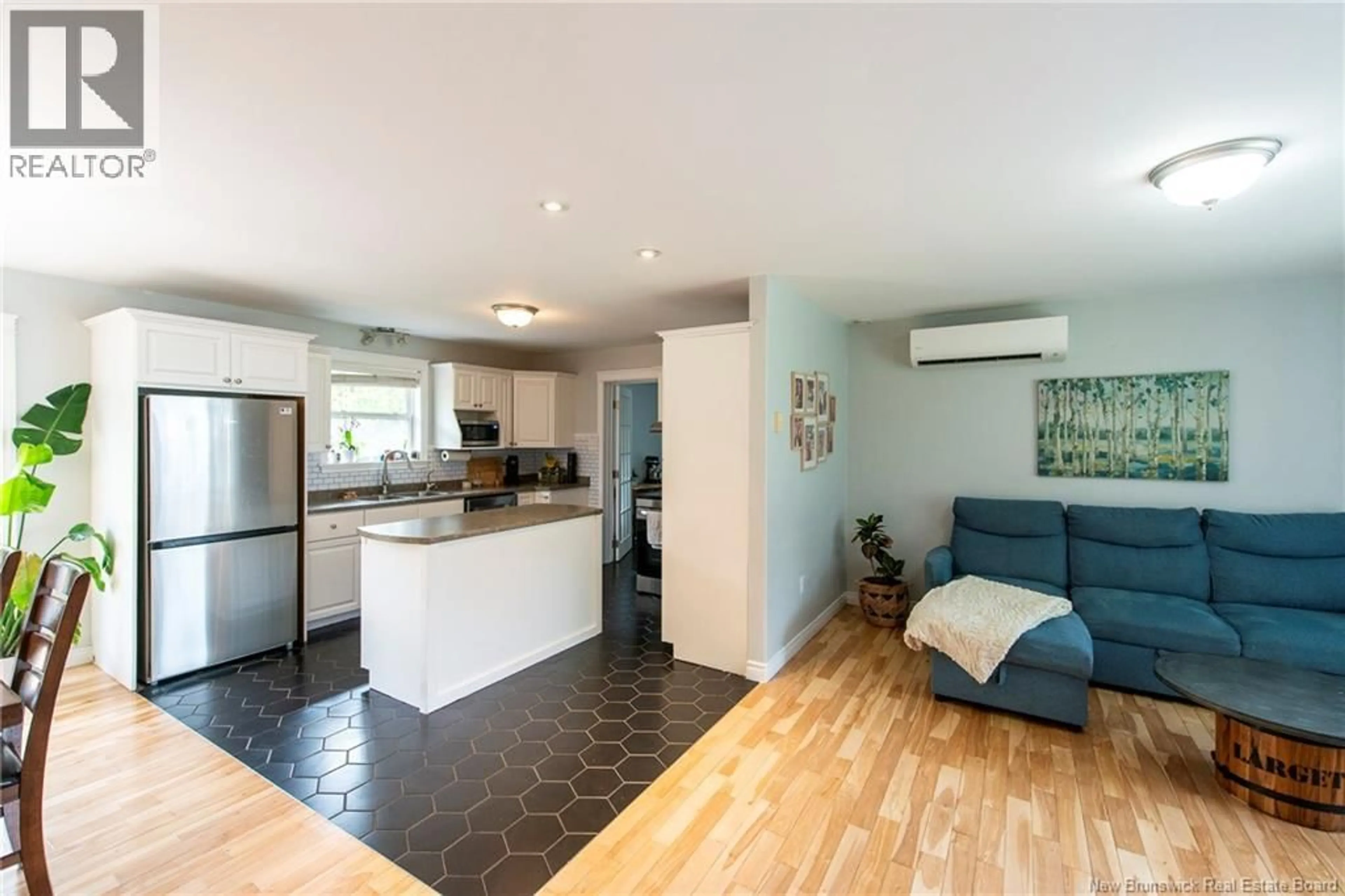 Open concept kitchen, wood/laminate floor for 10 QUEENSBURY DRIVE, Quispamsis New Brunswick E2E5B5