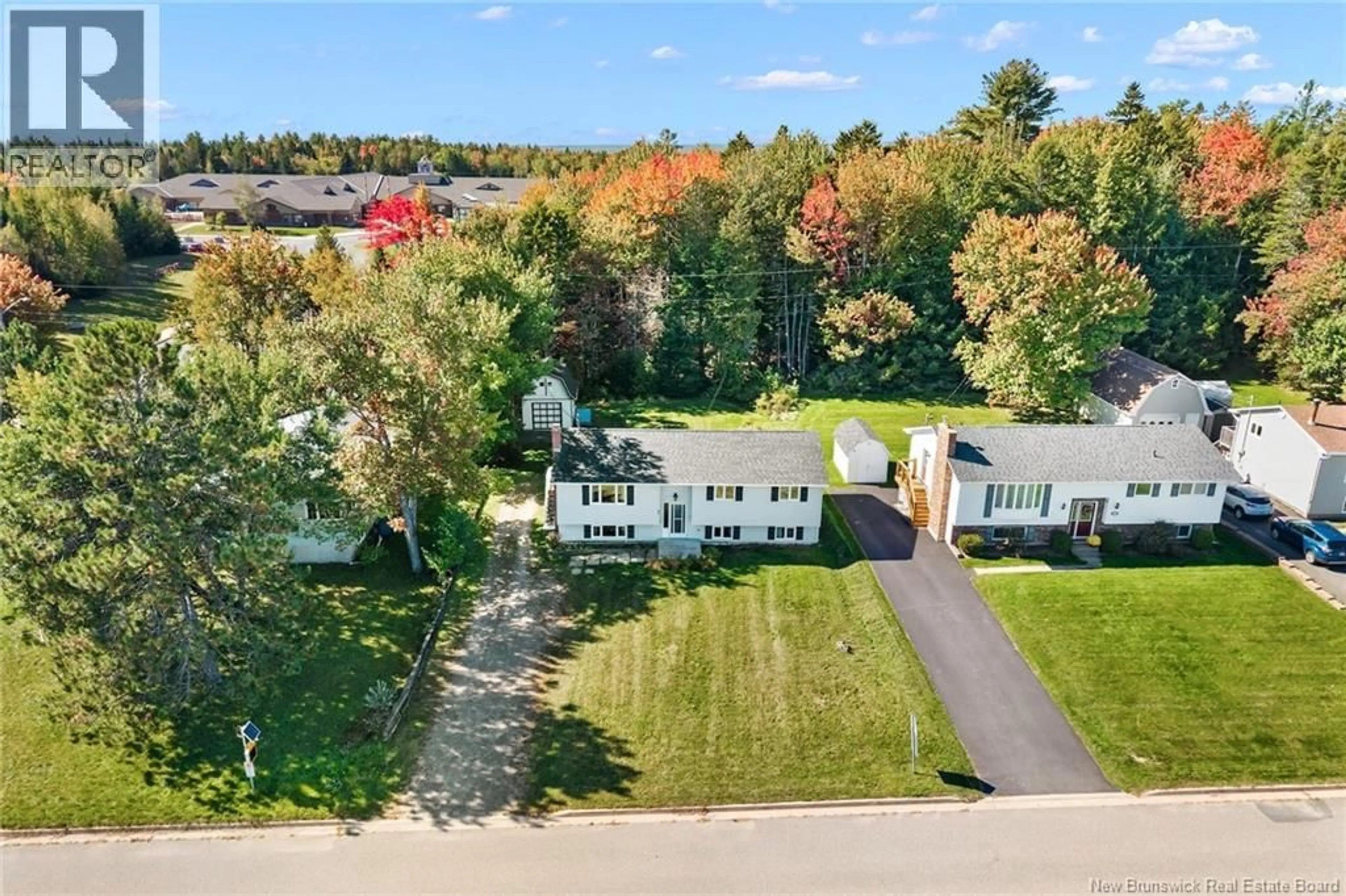 A pic from outside/outdoor area/front of a property/back of a property/a pic from drone, unknown for 95 SPRUCEWOOD DRIVE, New Maryland New Brunswick E3C1C5
