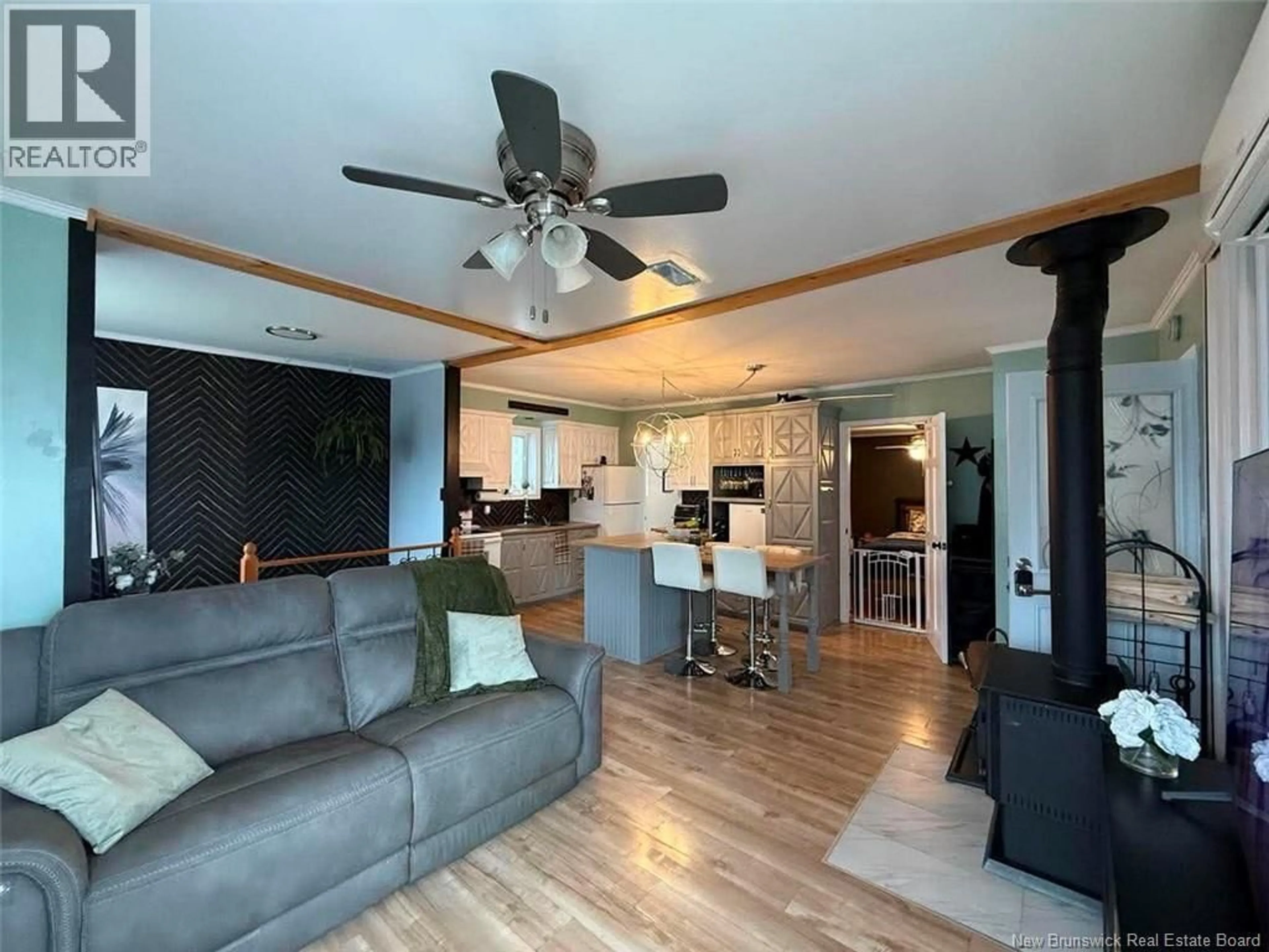 Living room with furniture, wood/laminate floor for 129 34TH AVENUE, Edmundston New Brunswick E3V2T4