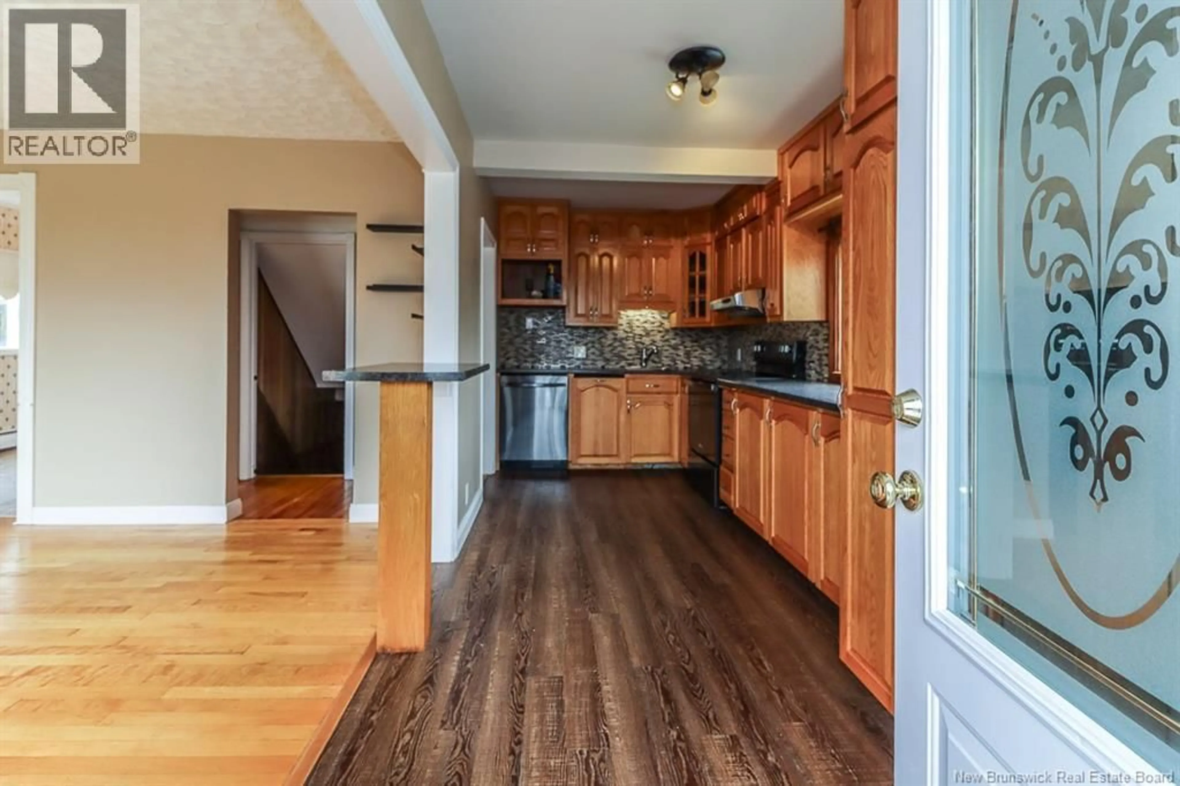 Open concept kitchen, wood/laminate floor for 31 KILBURN AVENUE, Saint John New Brunswick E2J2L4