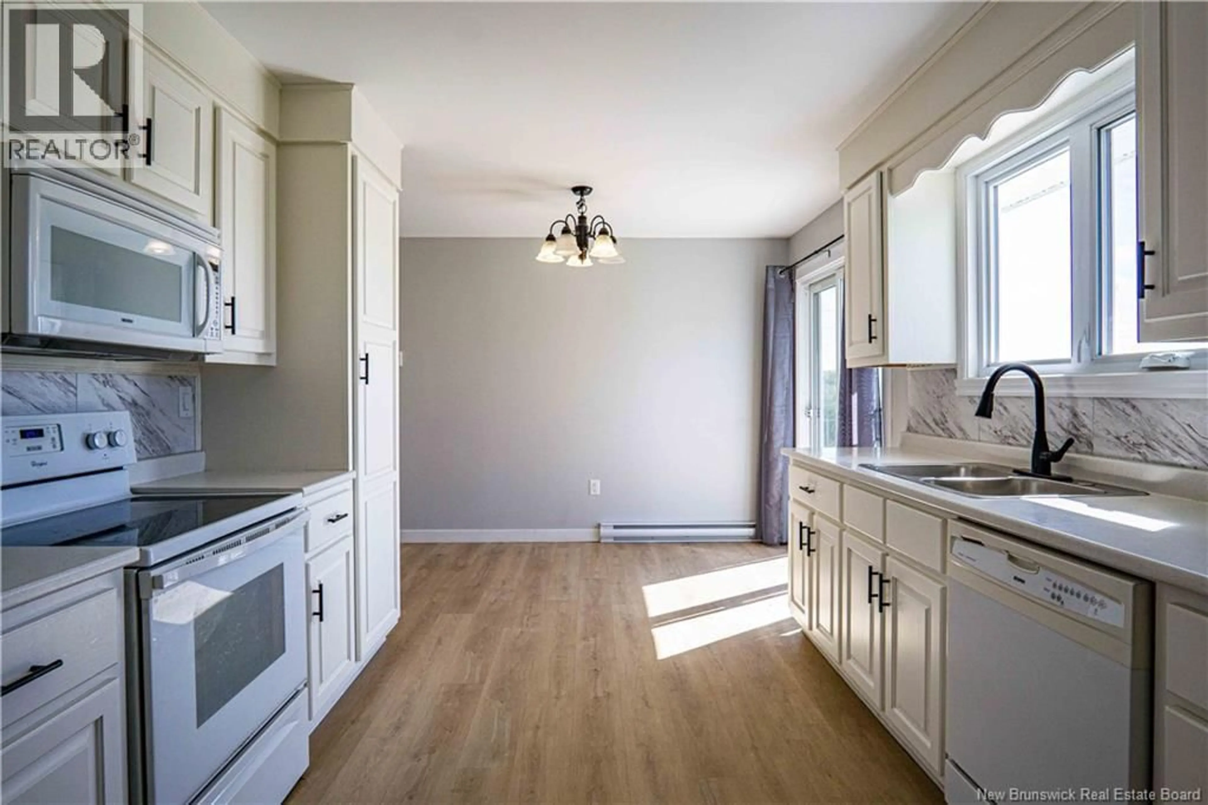Open concept kitchen, wood/laminate floor for 298 ROUTE 105, Maugerville New Brunswick E3A8G2