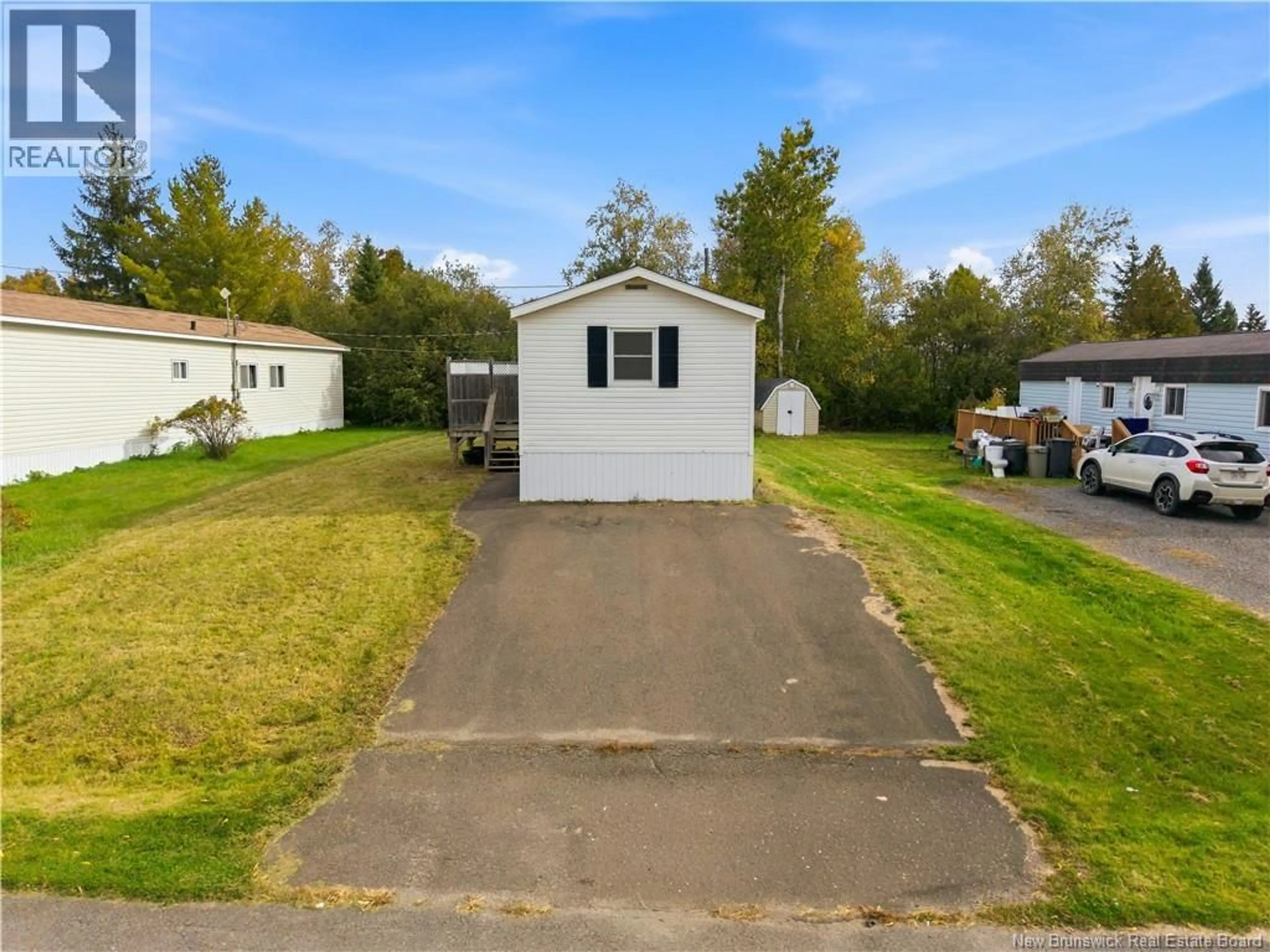 A pic from outside/outdoor area/front of a property/back of a property/a pic from drone, water/lake/river/ocean view for 90 EASTWOOD STREET, Fredericton New Brunswick E3B6P6