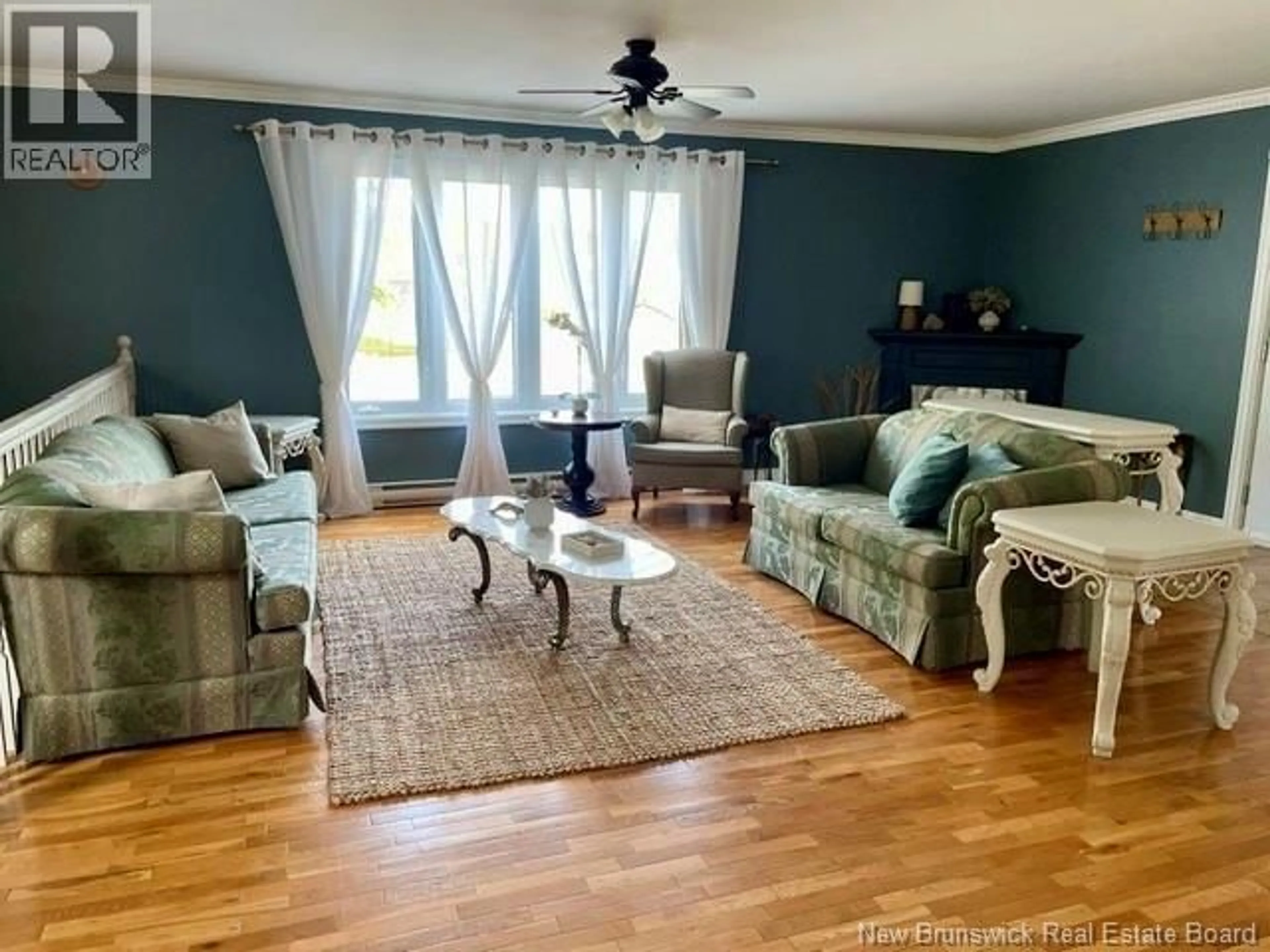Living room with furniture, wood/laminate floor for 423 DARLINGTON, Dalhousie New Brunswick E8C1M3