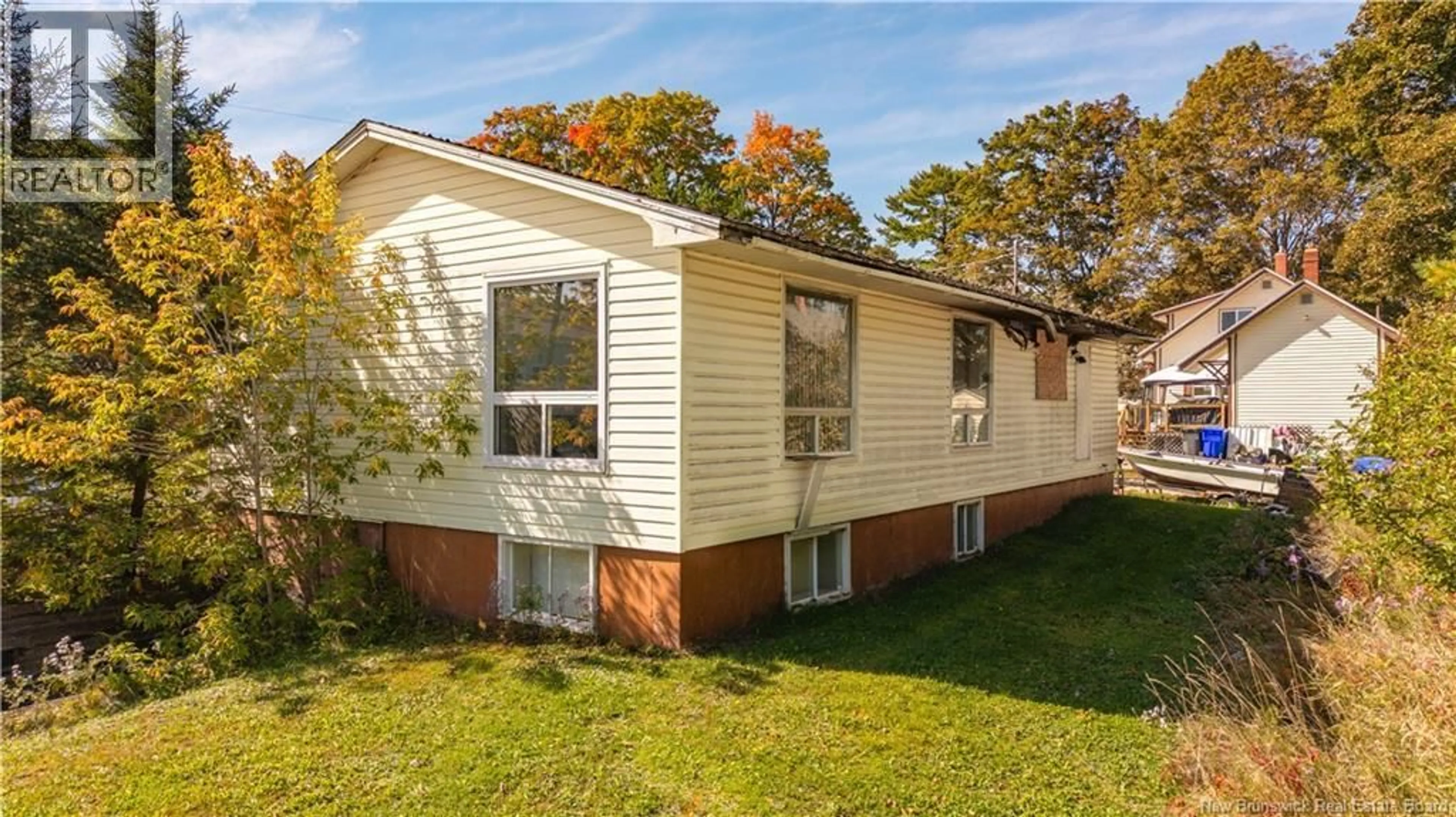 Home with vinyl exterior material, street for 33 VICTIORA STREET, St. Stephen New Brunswick E3L2S5