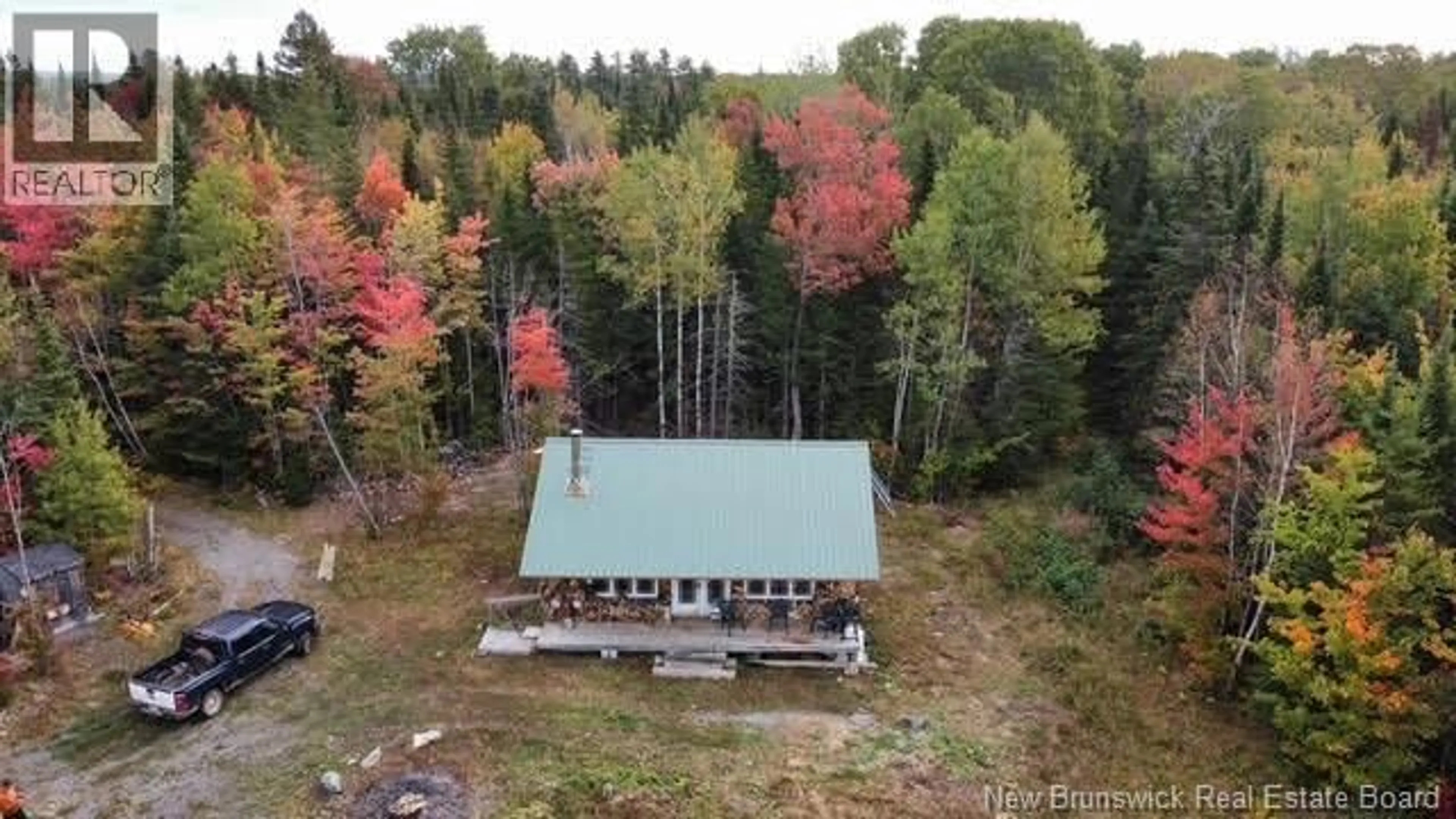 A pic from outside/outdoor area/front of a property/back of a property/a pic from drone, forest/trees view for CAMP KITCHEN SETTLEMENT ROAD, Prince William New Brunswick E6K3P9