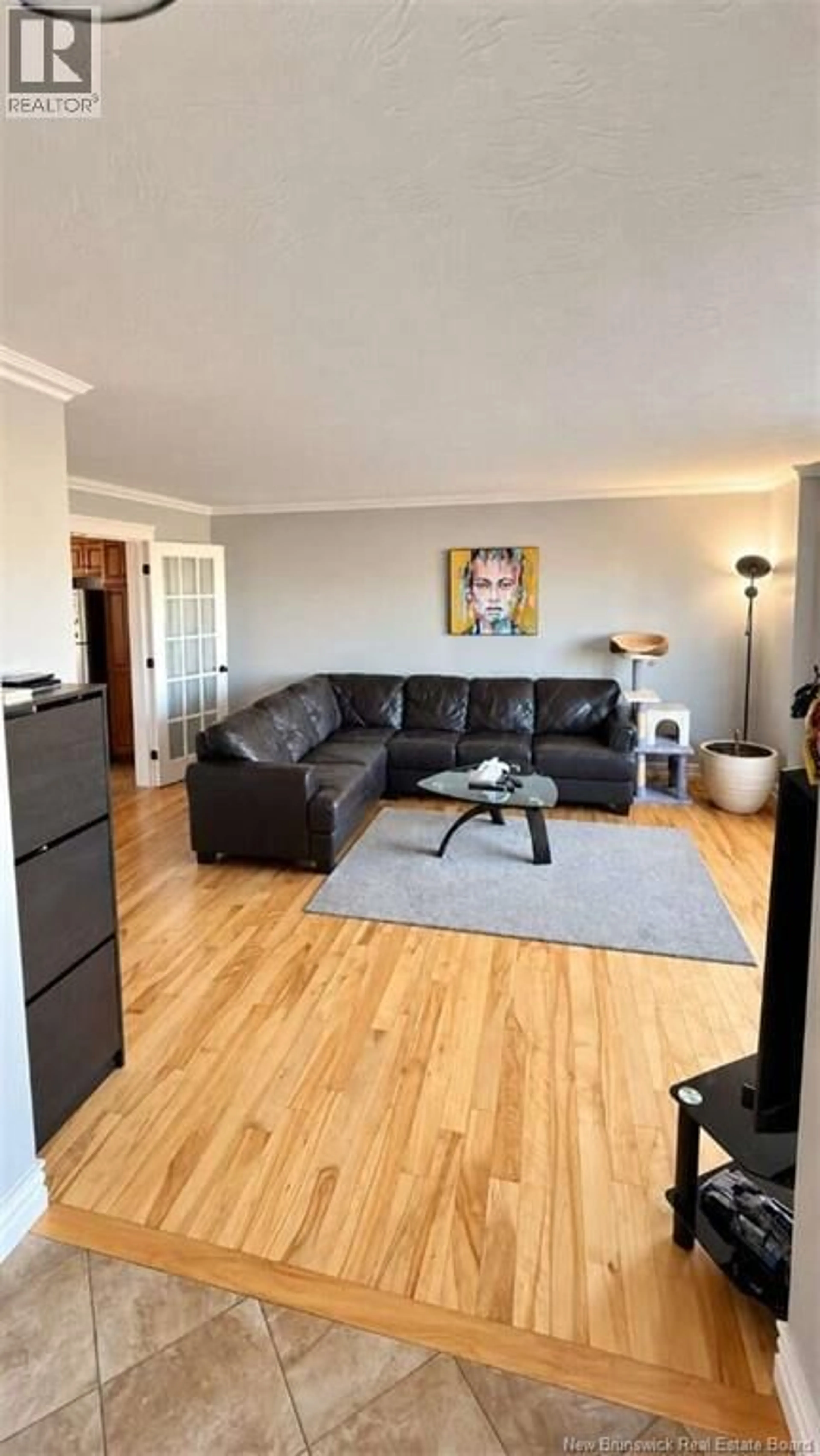 Living room with furniture, wood/laminate floor for 22 COACHMEN STREET, Riverview New Brunswick E1B0J7