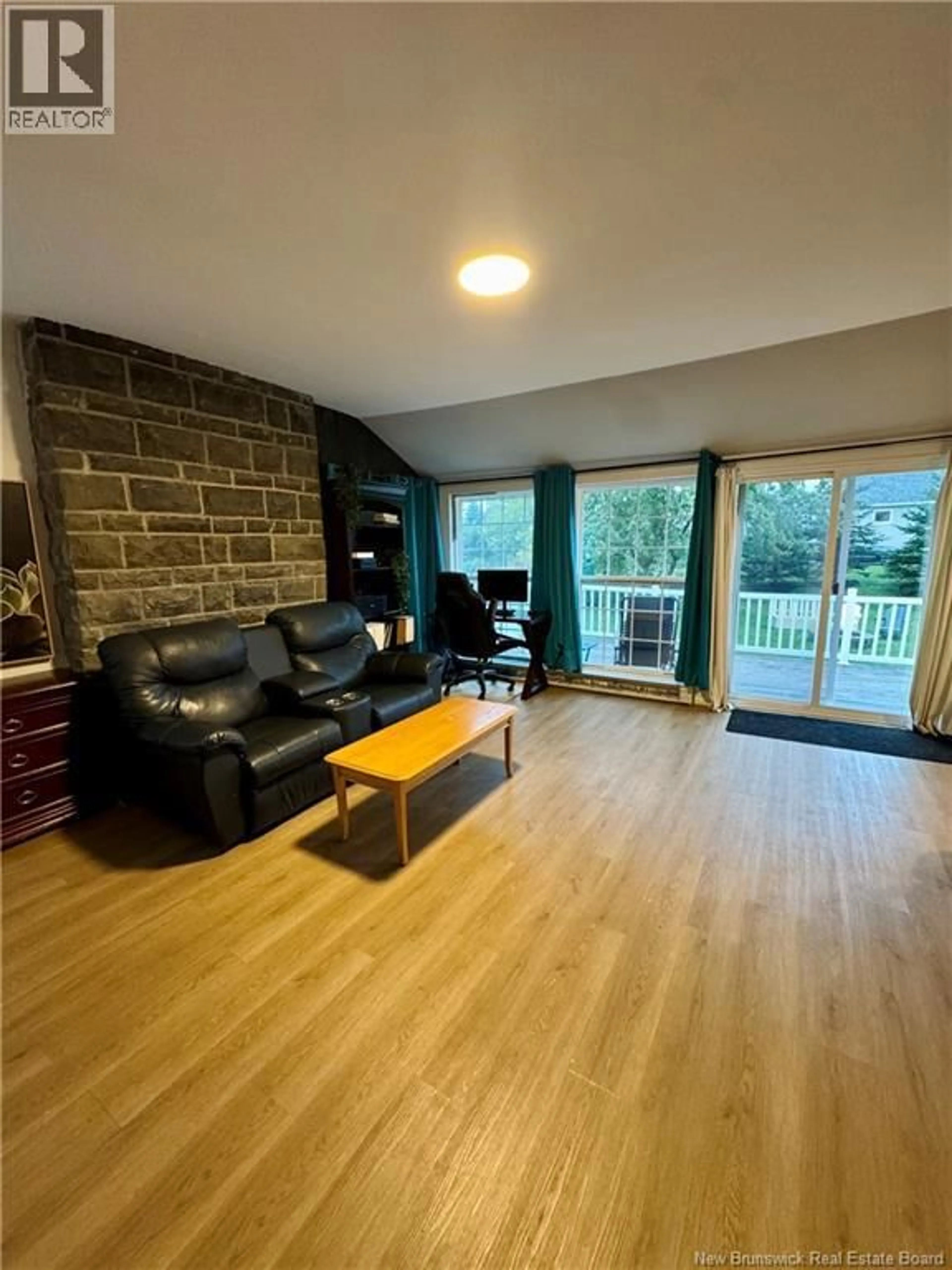 Living room with furniture, wood/laminate floor for 23 SUNSET LANE, Pointe-Du-Chêne New Brunswick E4P5H2
