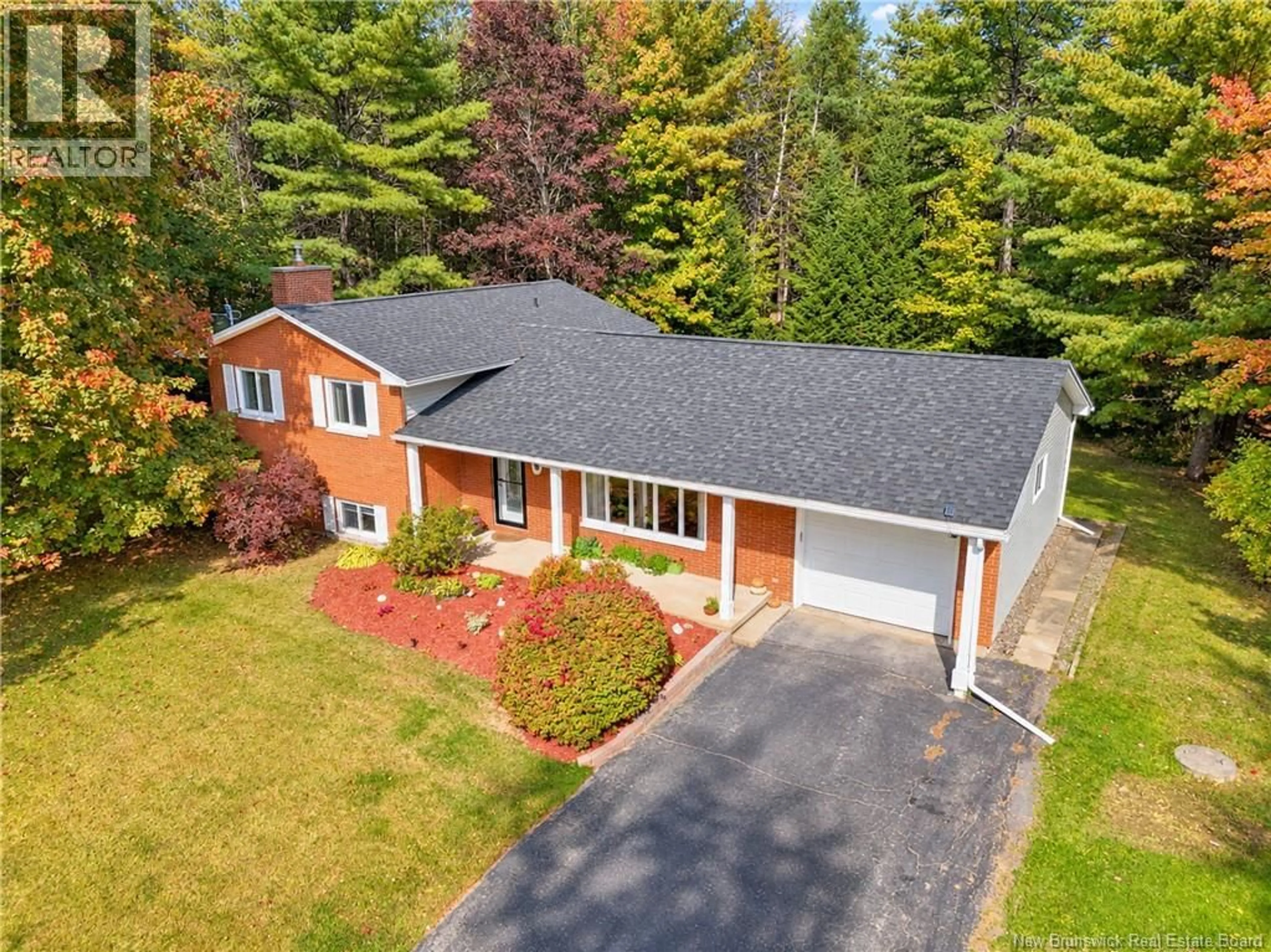 A pic from outside/outdoor area/front of a property/back of a property/a pic from drone, unknown for 9 NEPTUNE CRESCENT, Hanwell New Brunswick E3C1M7