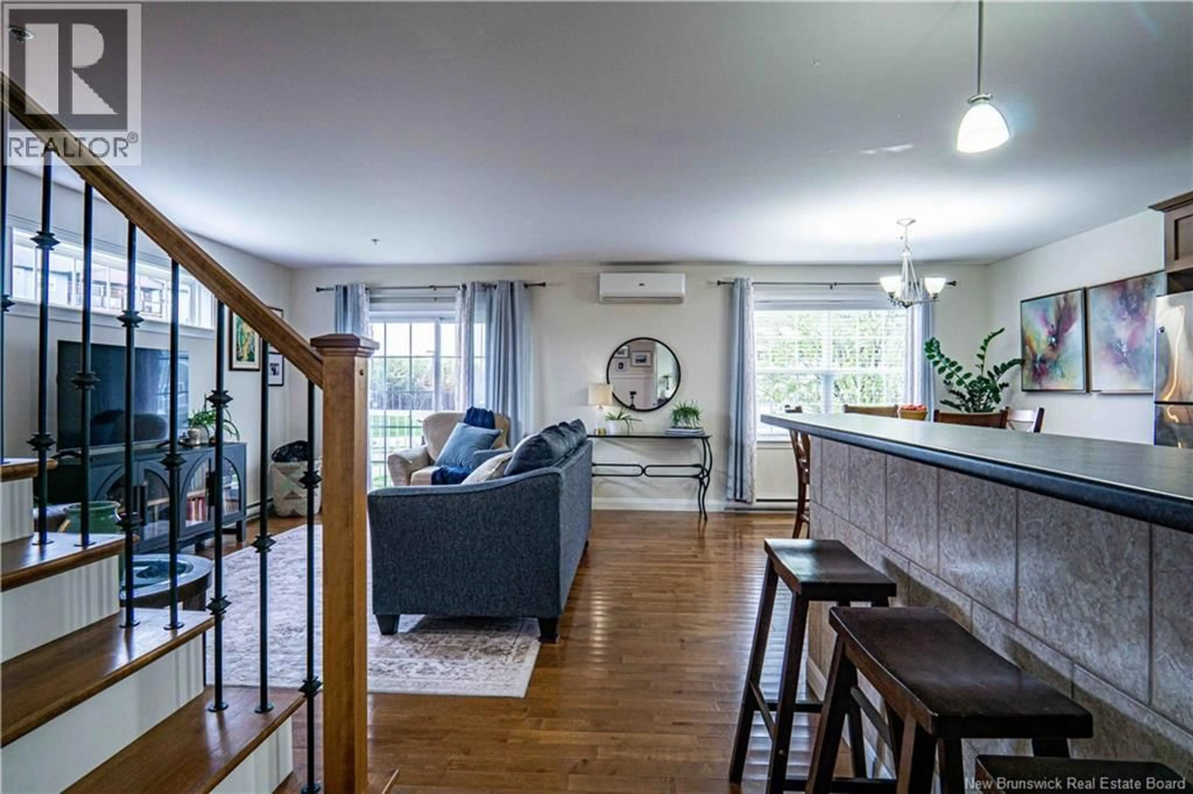 Living room with furniture, wood/laminate floor for 112 - 700 CLIFFE STREET, Fredericton New Brunswick E3A5V2