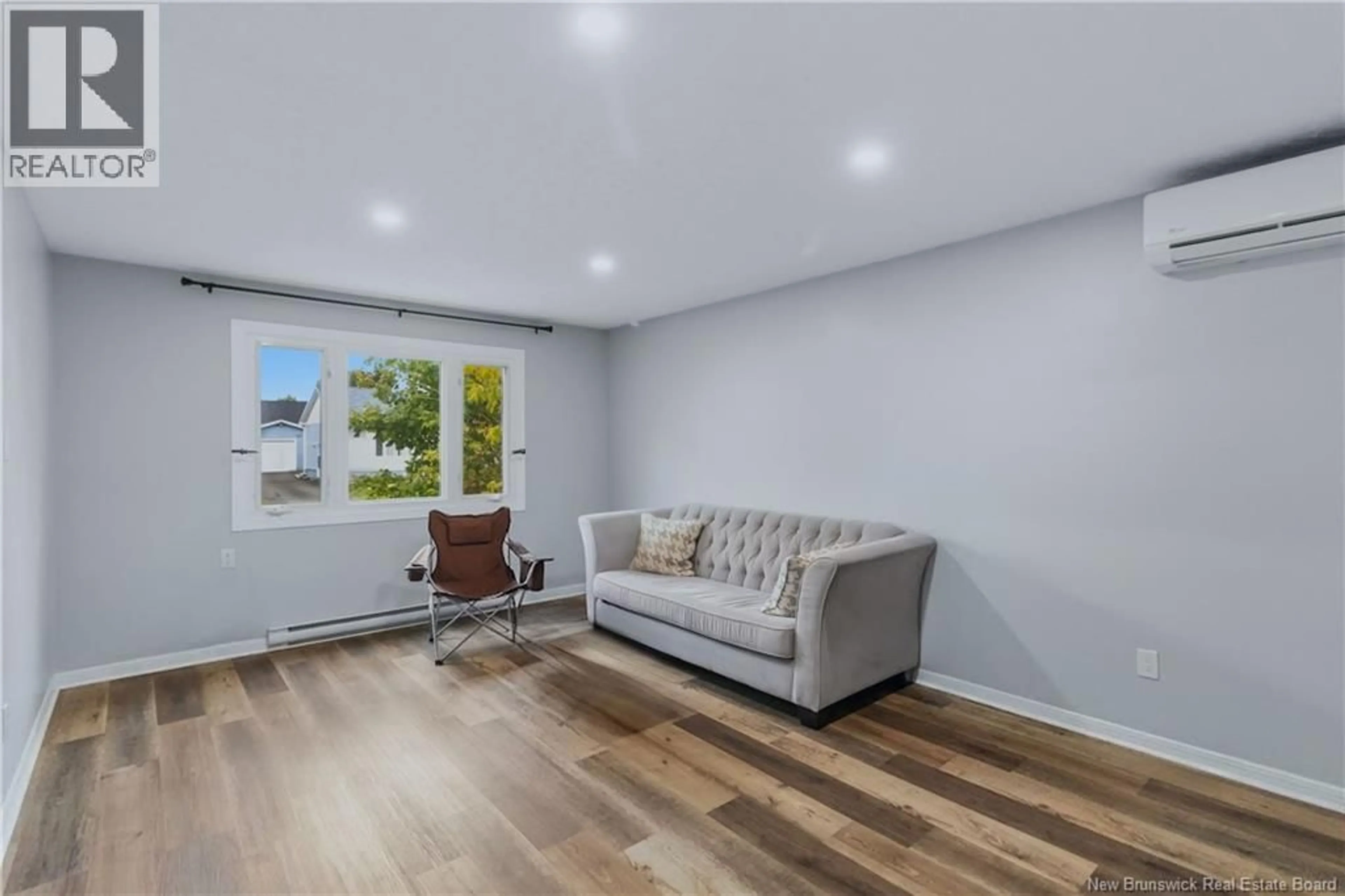 Living room with furniture, wood/laminate floor for 7 JAMES STREET, Moncton New Brunswick E1C3Z8