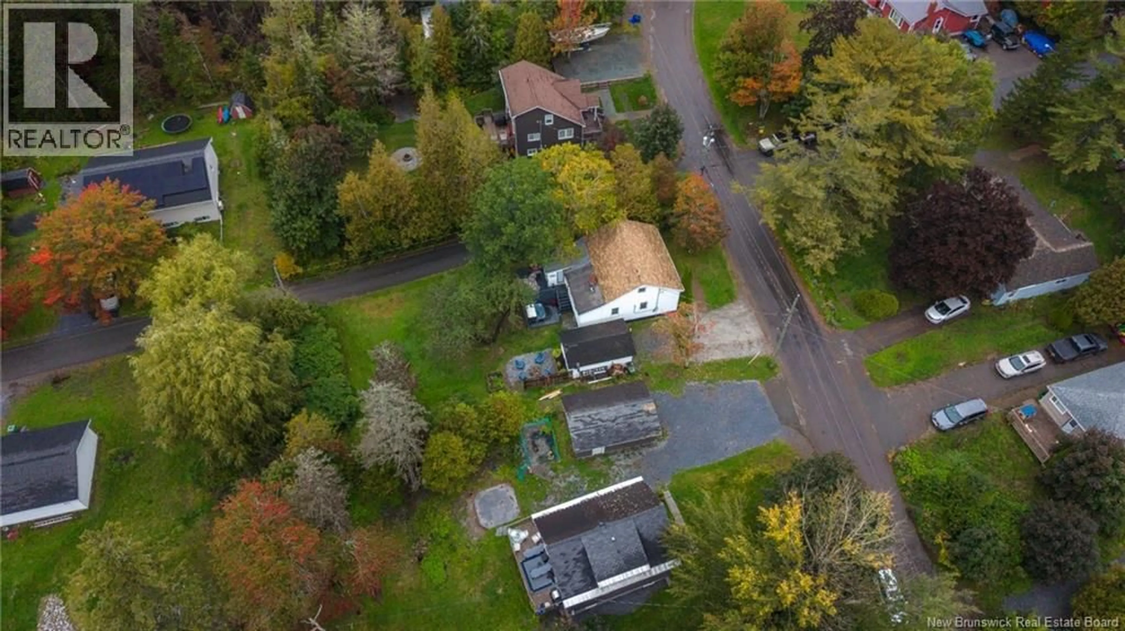 A pic from outside/outdoor area/front of a property/back of a property/a pic from drone, street for 63 STEVENS ROAD, Saint John New Brunswick E2M6X4