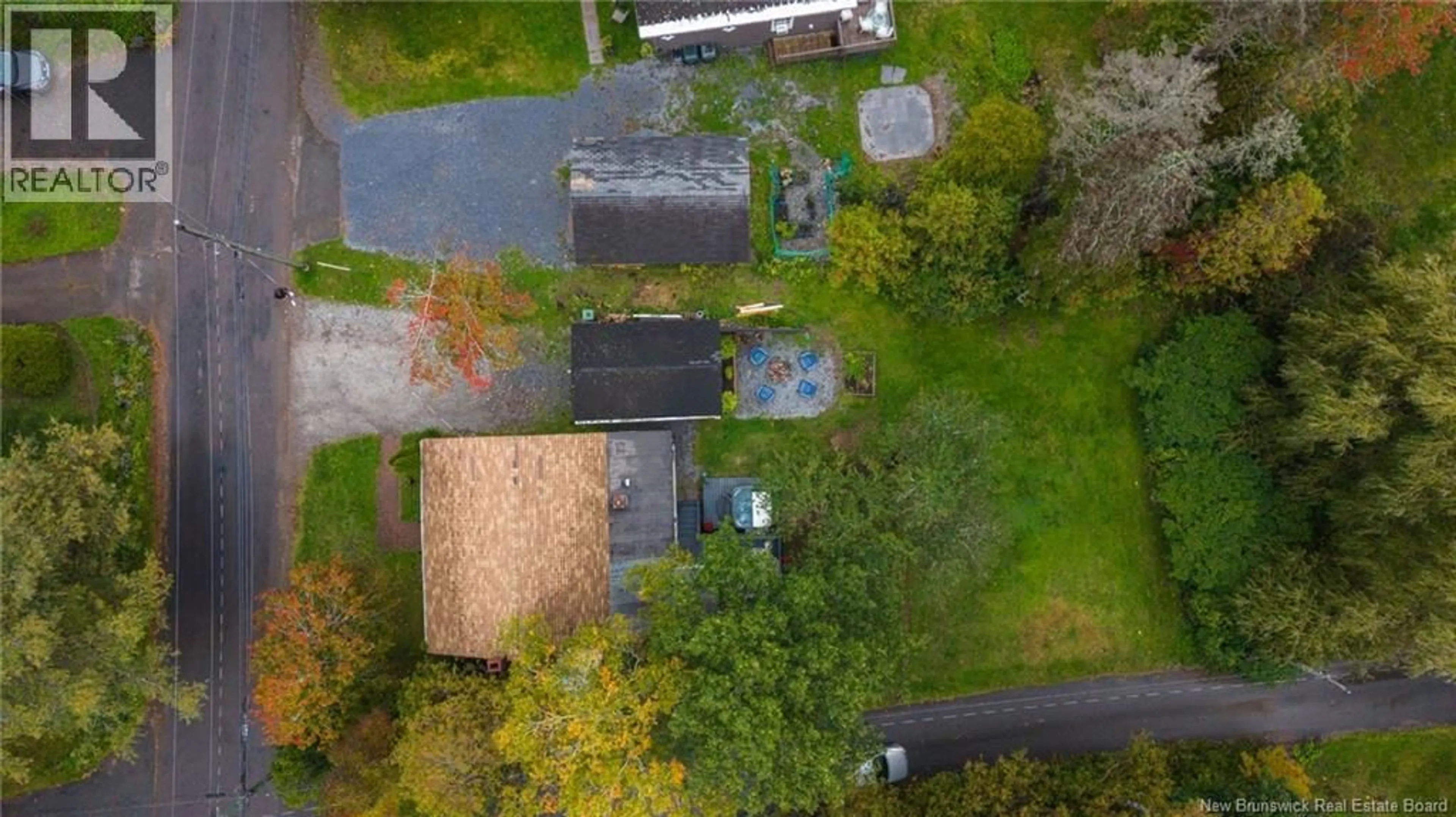 A pic from outside/outdoor area/front of a property/back of a property/a pic from drone, street for 63 STEVENS ROAD, Saint John New Brunswick E2M6X4