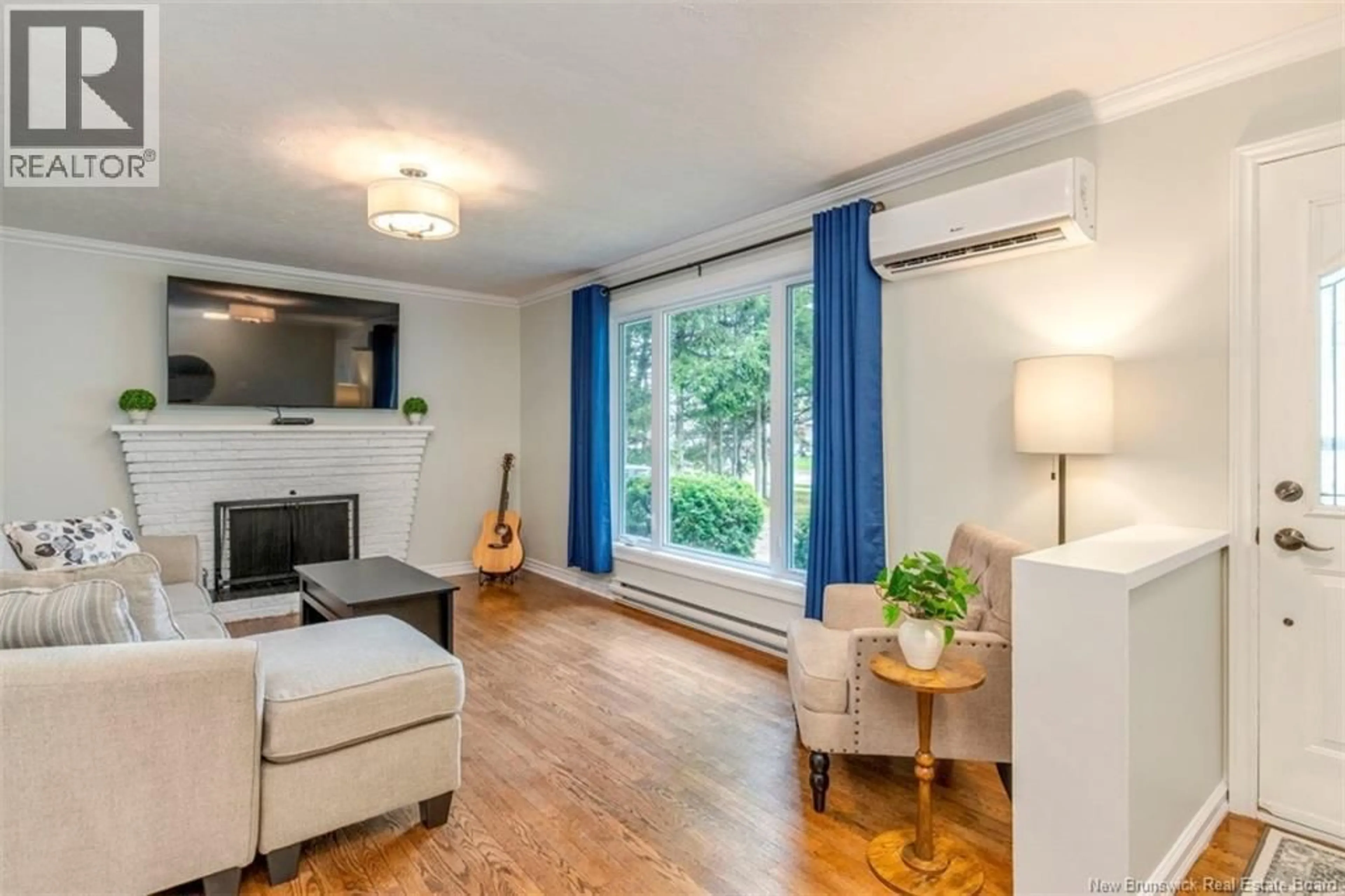 Living room with furniture, wood/laminate floor for 381 BEAUMONT STREET, Dieppe New Brunswick E1A1A7