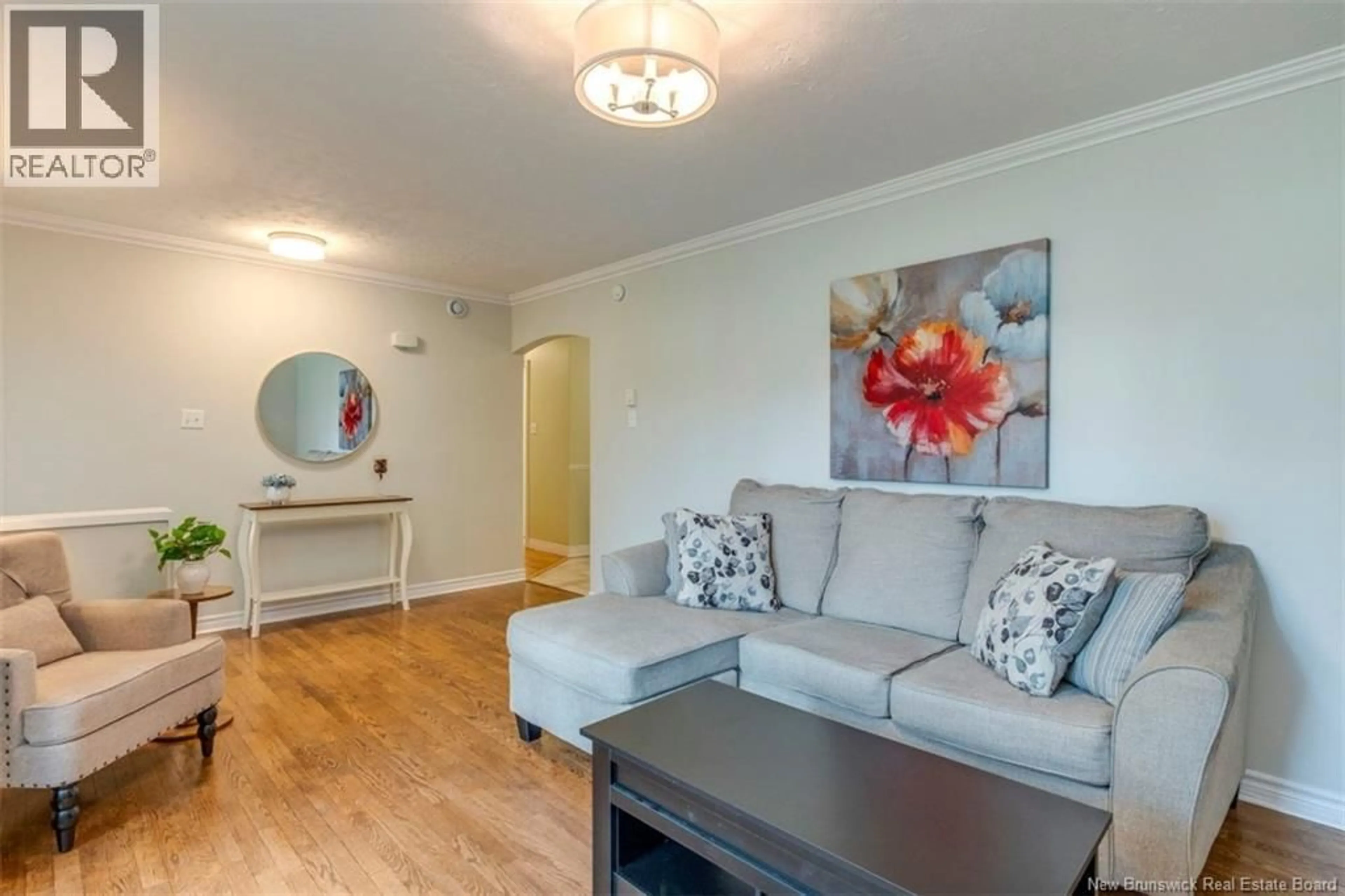 Living room with furniture, wood/laminate floor for 381 BEAUMONT STREET, Dieppe New Brunswick E1A1A7