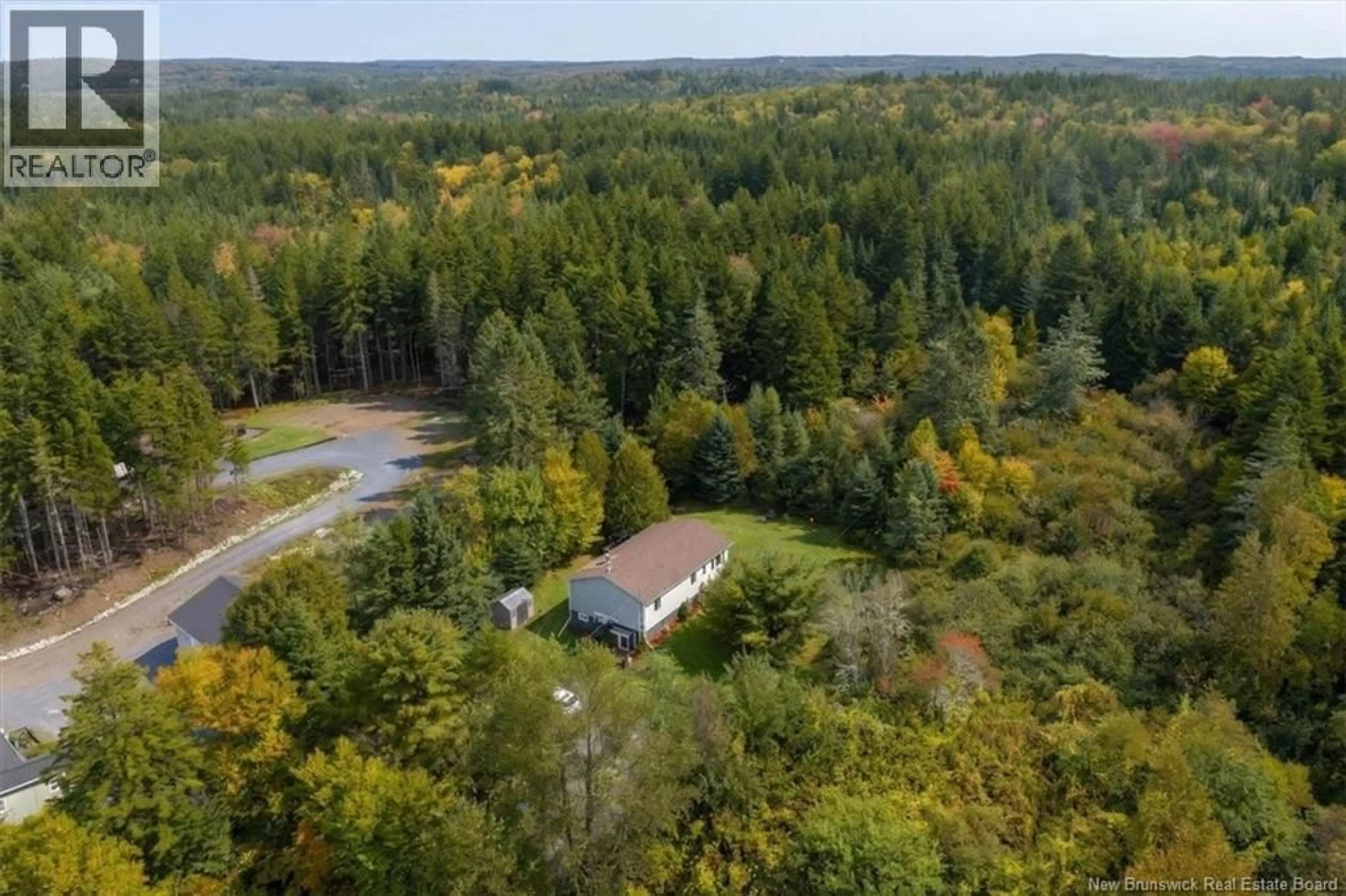 A pic from outside/outdoor area/front of a property/back of a property/a pic from drone, forest/trees view for 130 HILLCREST ROAD, Saint John New Brunswick E2N1T3