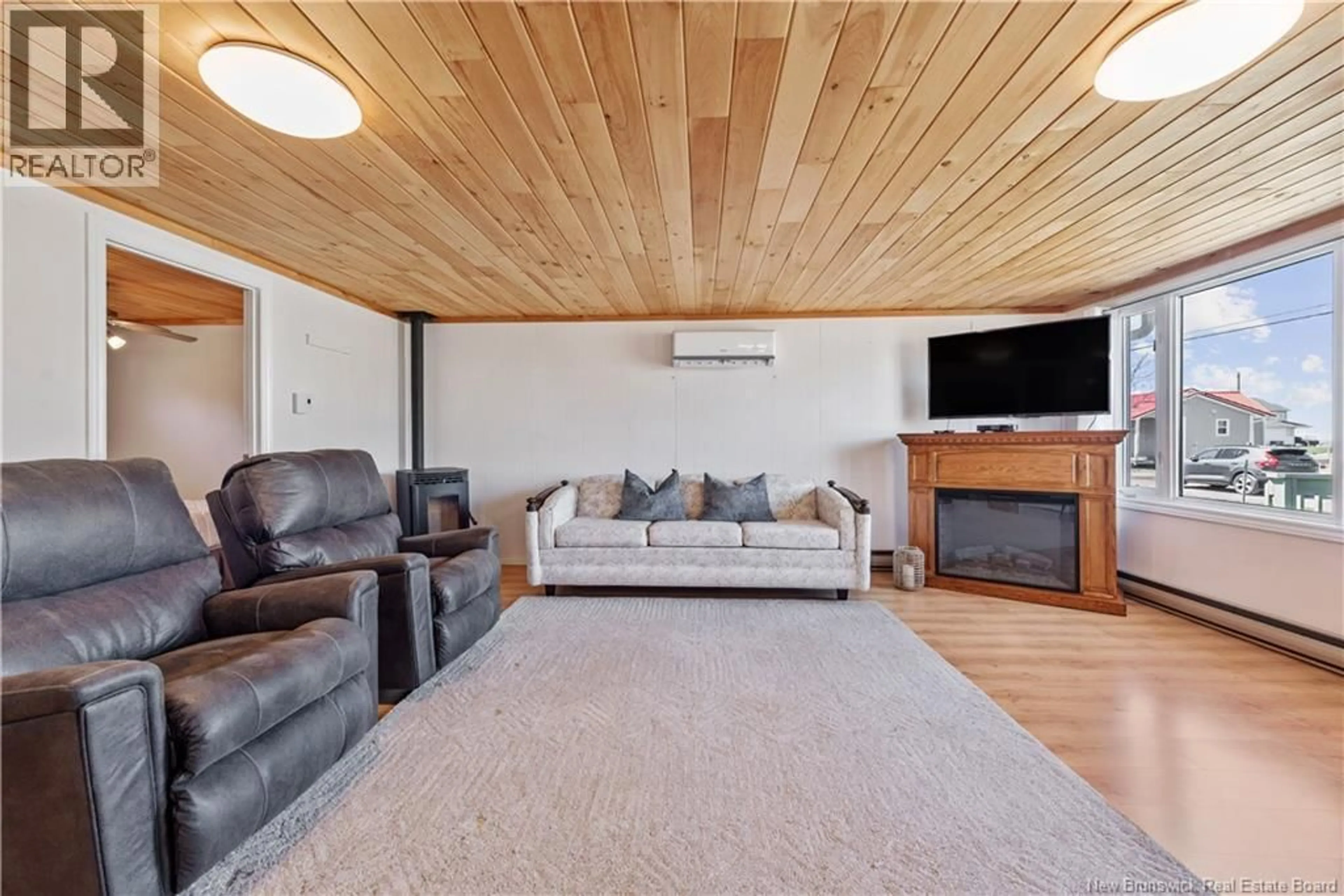 Living room with furniture, wood/laminate floor for 61 BAYBREEZE LANE, Grand-Barachois New Brunswick E4P6W9