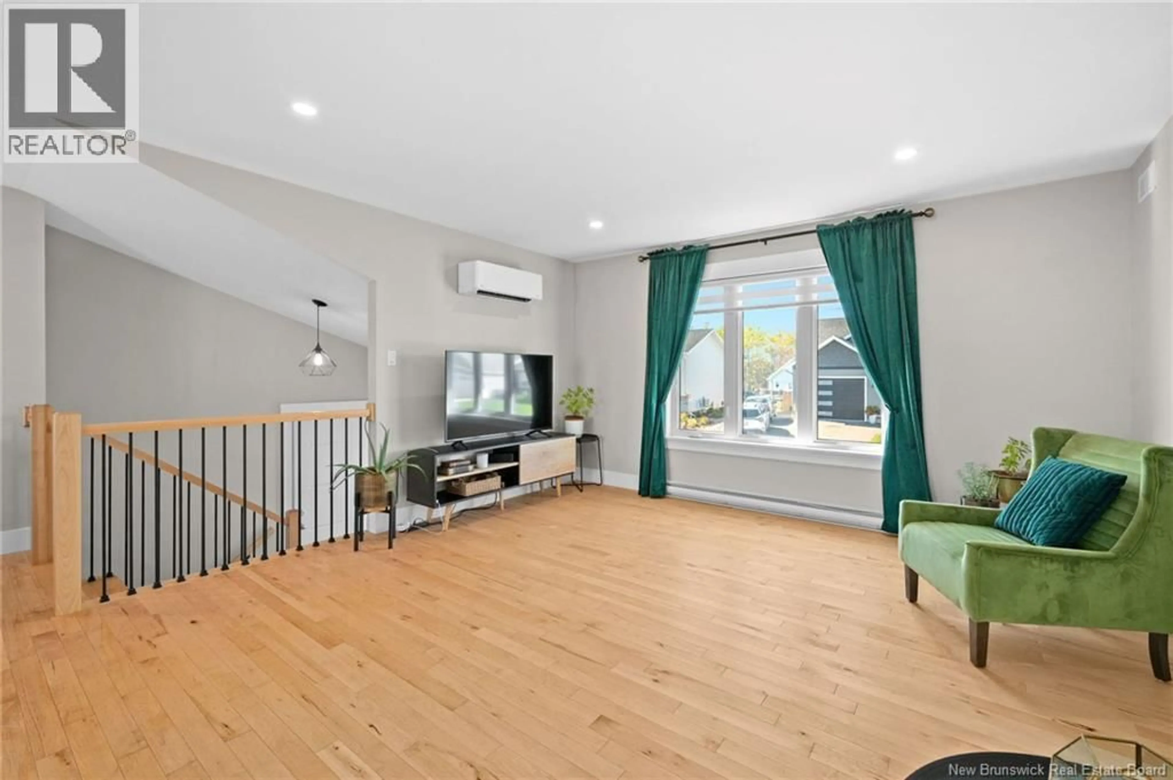 Living room with furniture, wood/laminate floor for 14 ROBERT STREET, Shediac New Brunswick E4P0R2