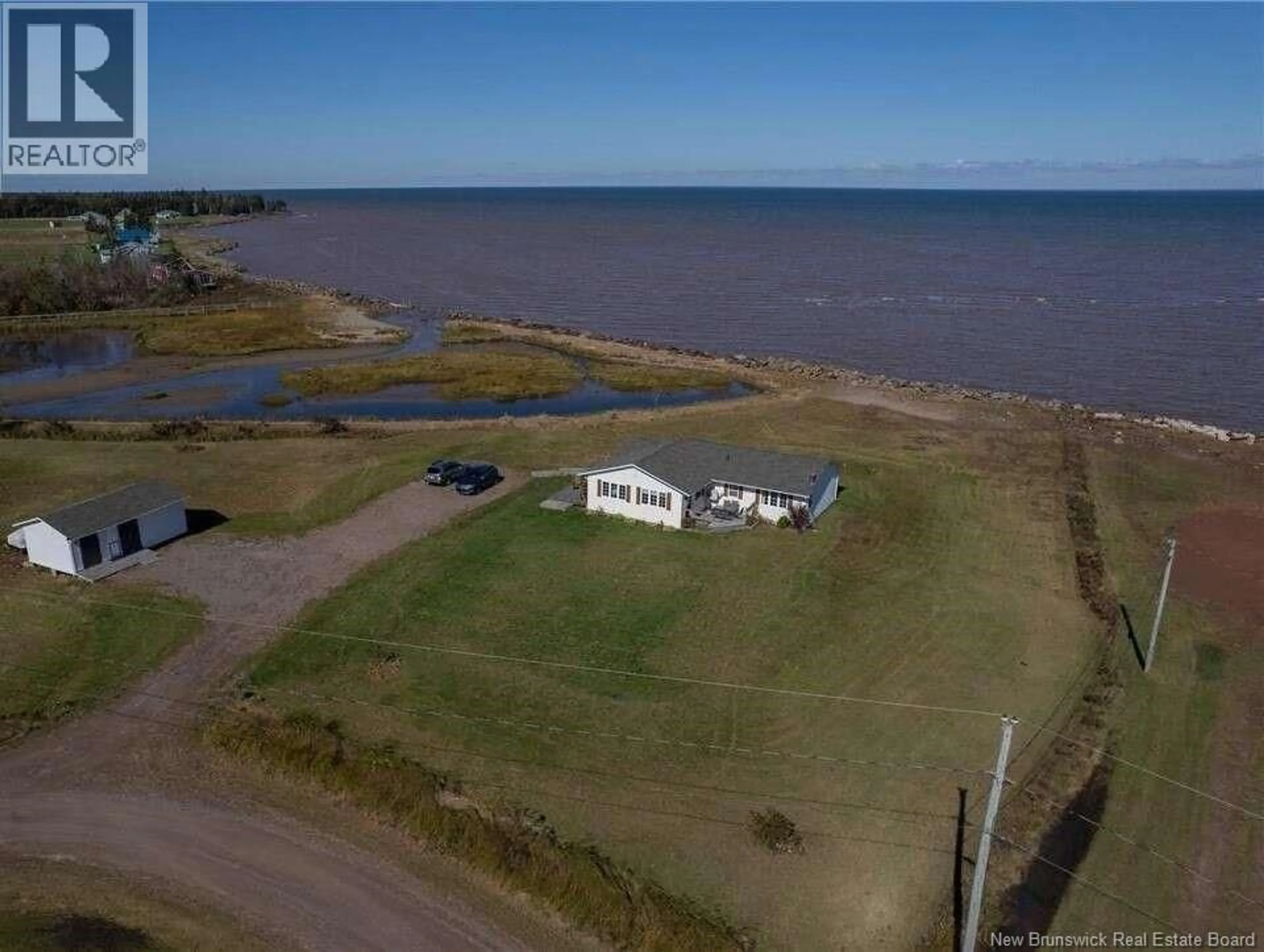 A pic from outside/outdoor area/front of a property/back of a property/a pic from drone, water/lake/river/ocean view for 16 SPENCE'S BEACH ROAD, Murray Corner New Brunswick E4M3R5
