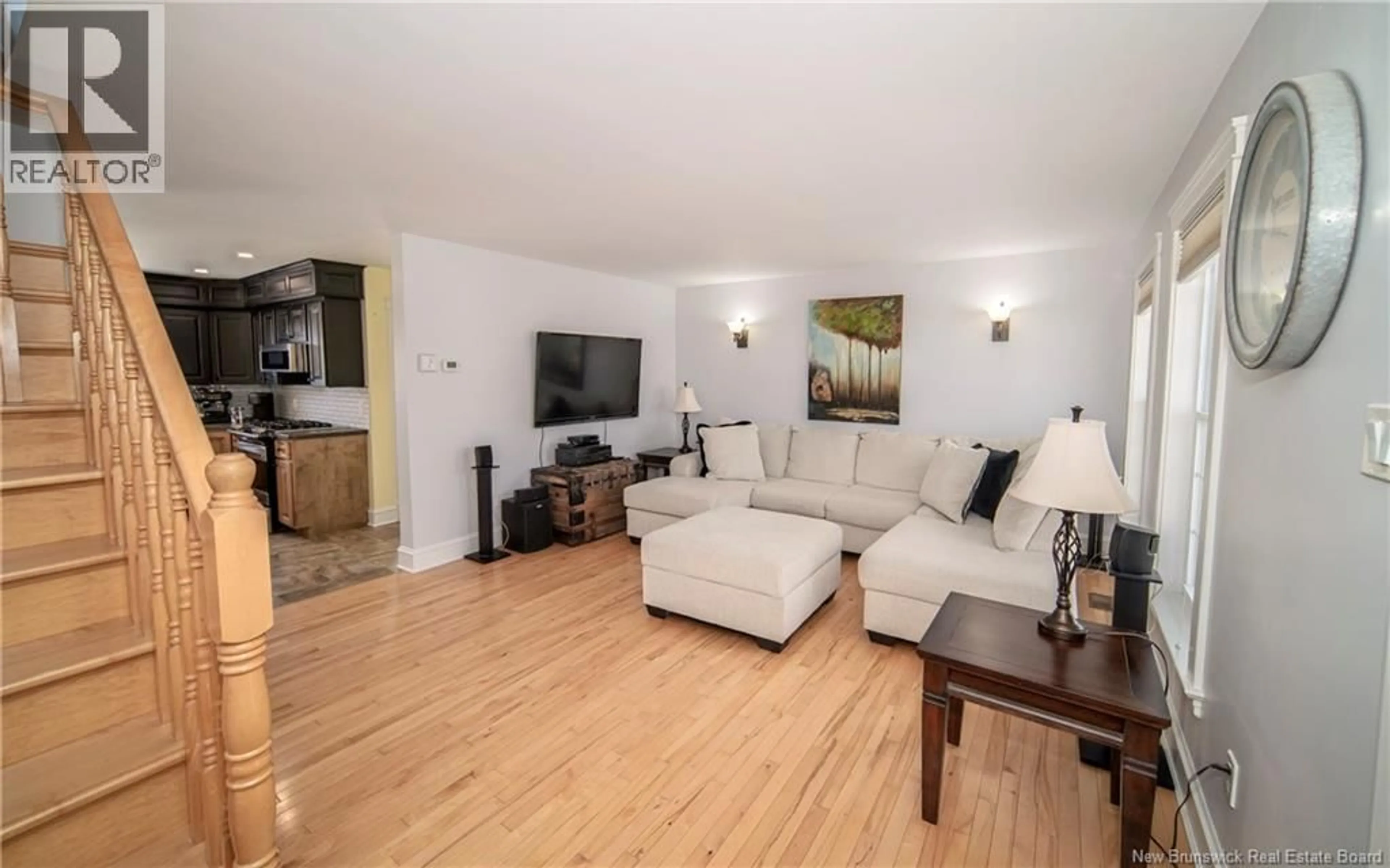 Living room with furniture, wood/laminate floor for 38 RED MAPLE COURT, Fredericton New Brunswick E3B0E1