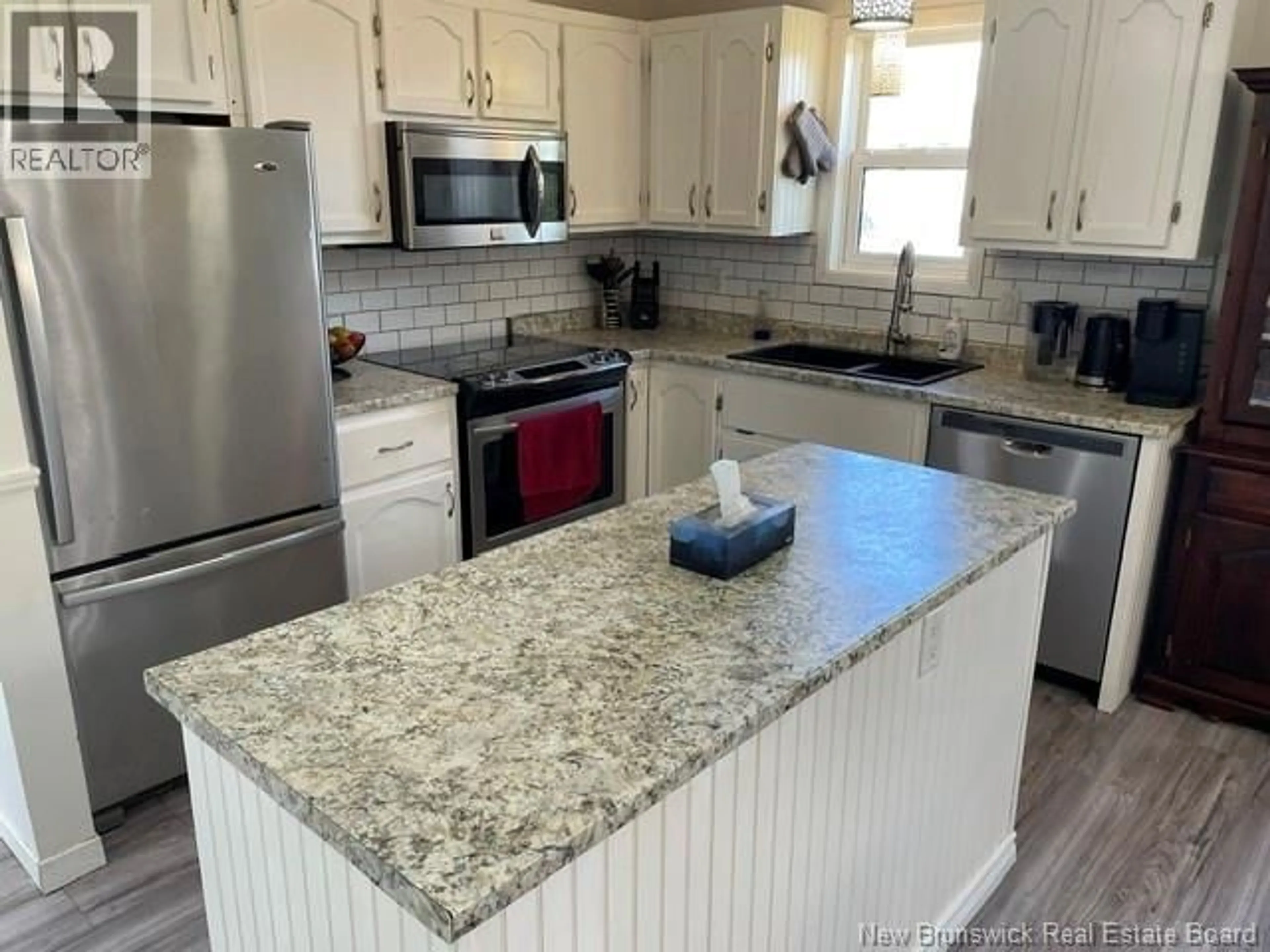 Open concept kitchen, ceramic/tile floor for 18 PARTELLOW STREET, Saint John New Brunswick E2J1G4