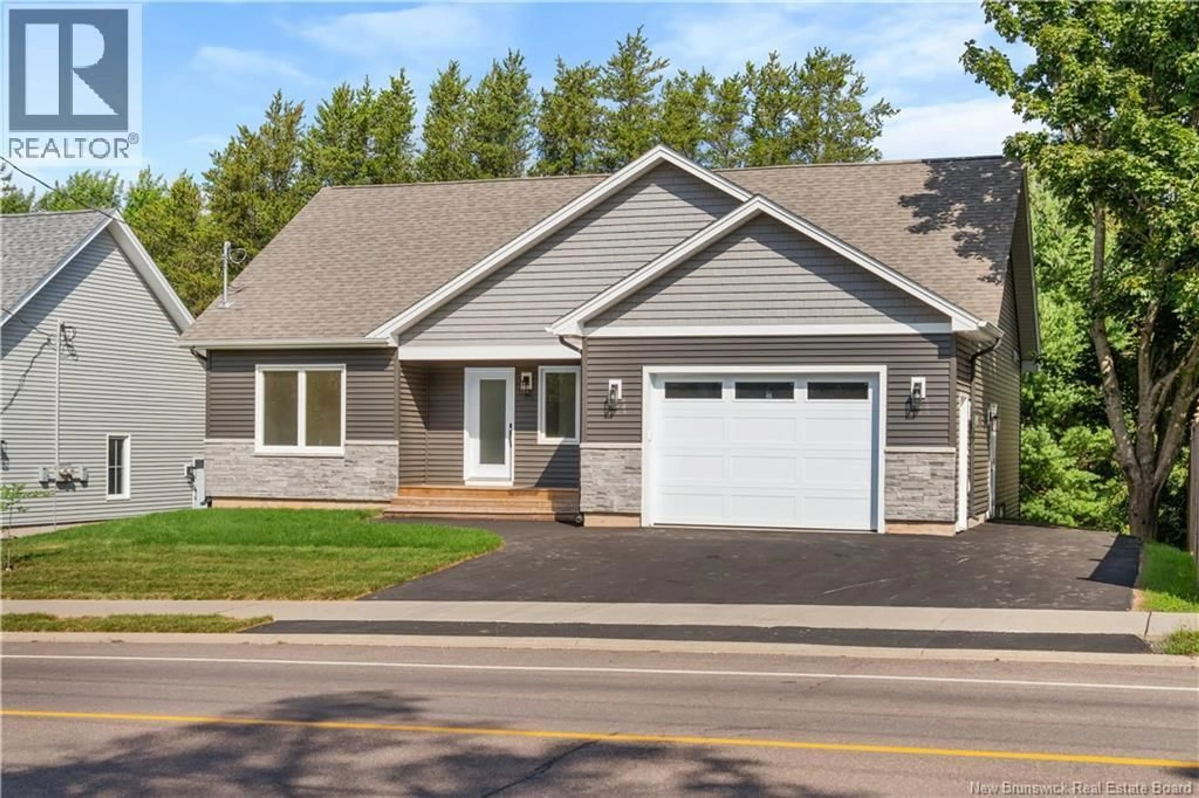 Home with vinyl exterior material, street for 214 BREAUX BRIDGE STREET, Shediac New Brunswick E4P0Y3