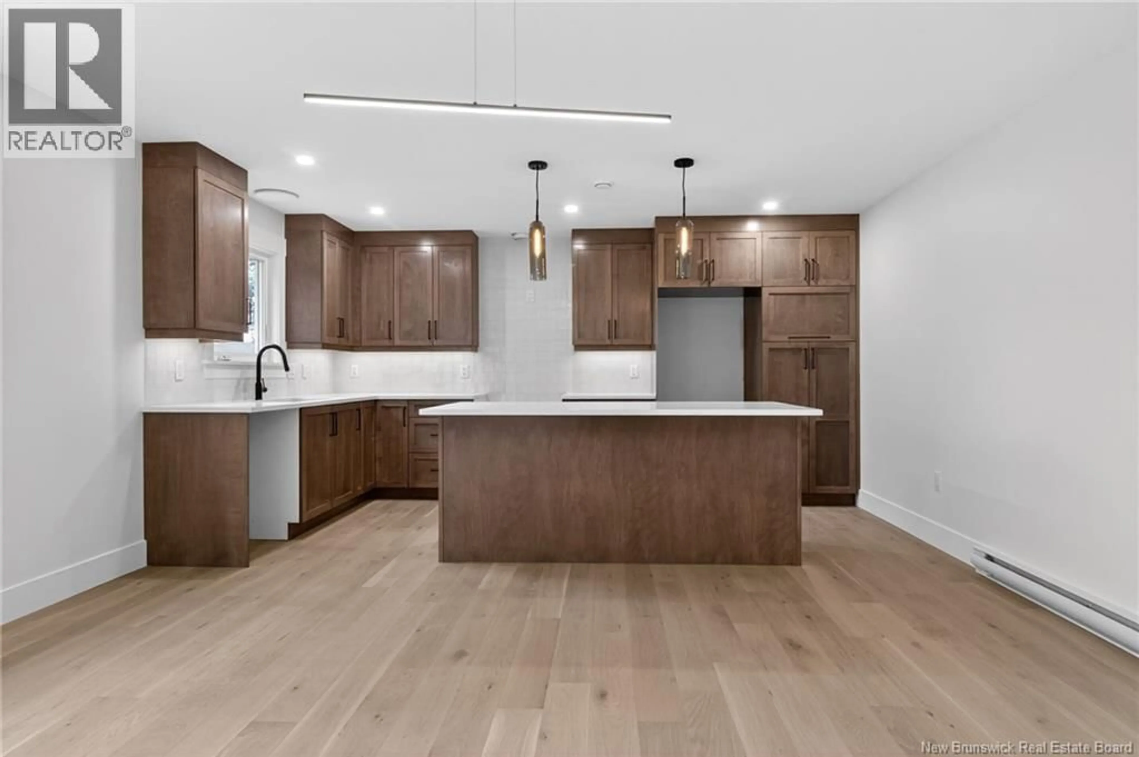 Open concept kitchen, wood/laminate floor for 214 BREAUX BRIDGE STREET, Shediac New Brunswick E4P0Y3