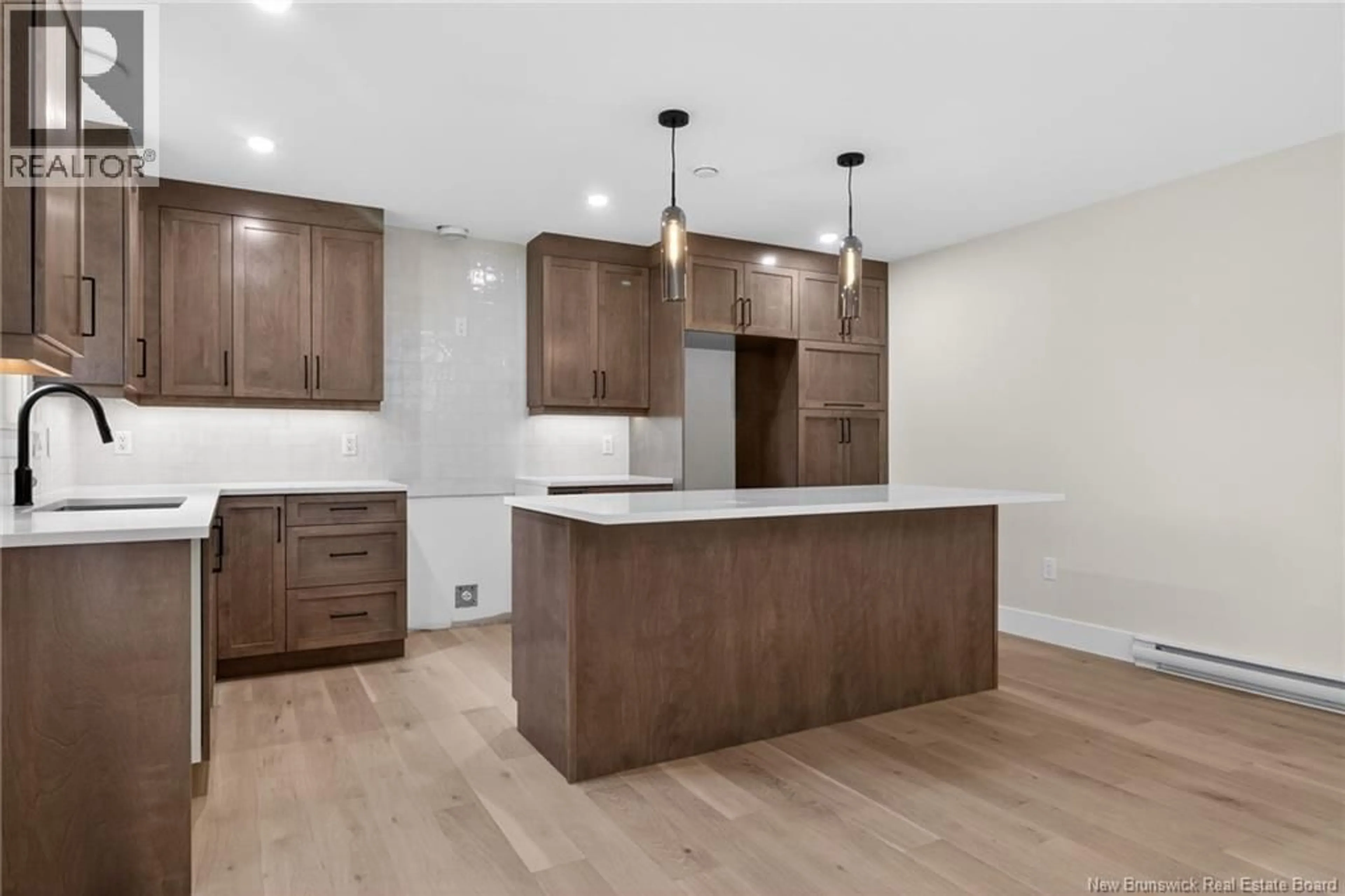 Open concept kitchen, wood/laminate floor for 214 BREAUX BRIDGE STREET, Shediac New Brunswick E4P0Y3
