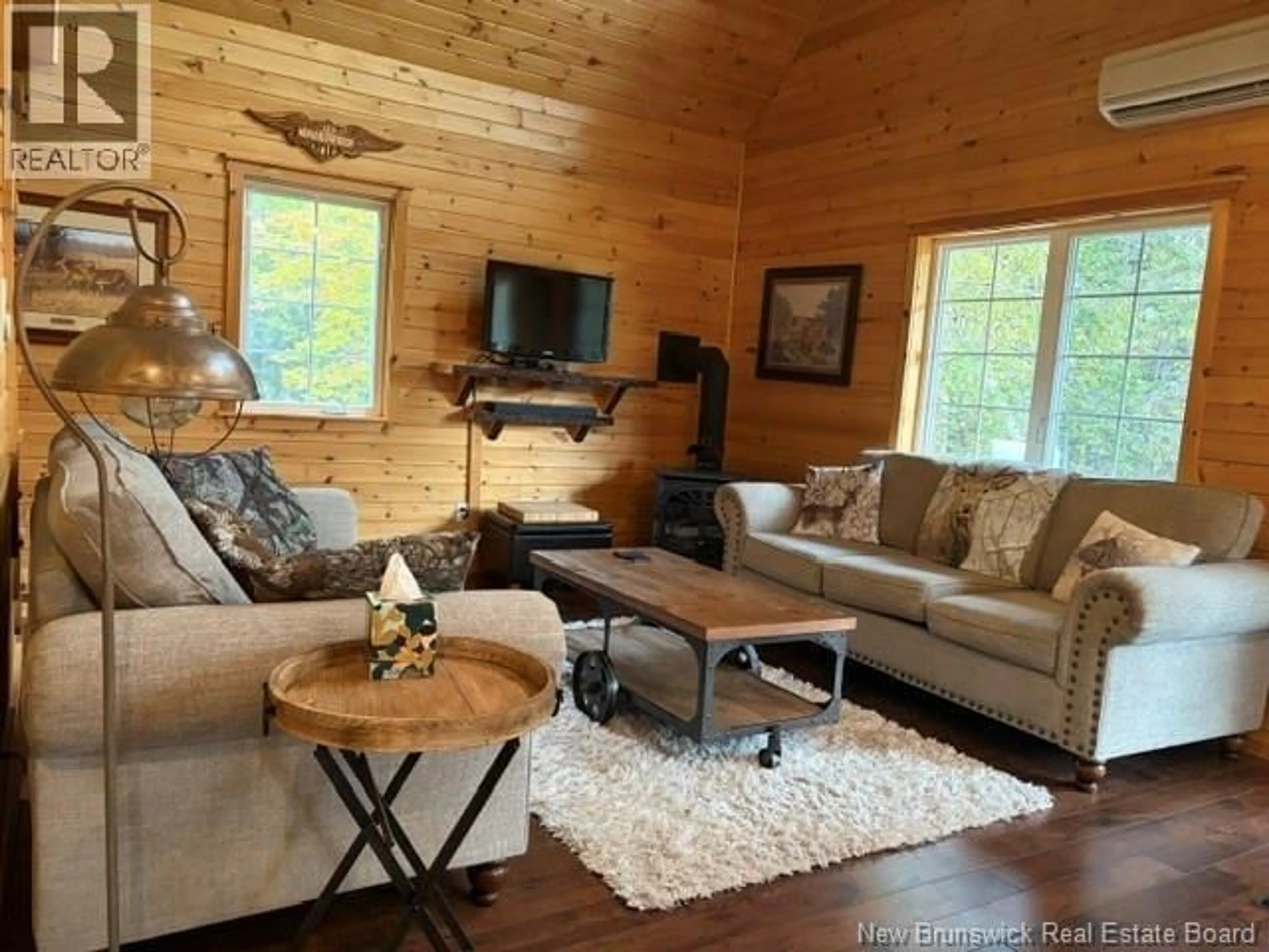 Living room with furniture, wood/laminate floor for 11550 ROUTE 114, Springdale New Brunswick E4E5G1