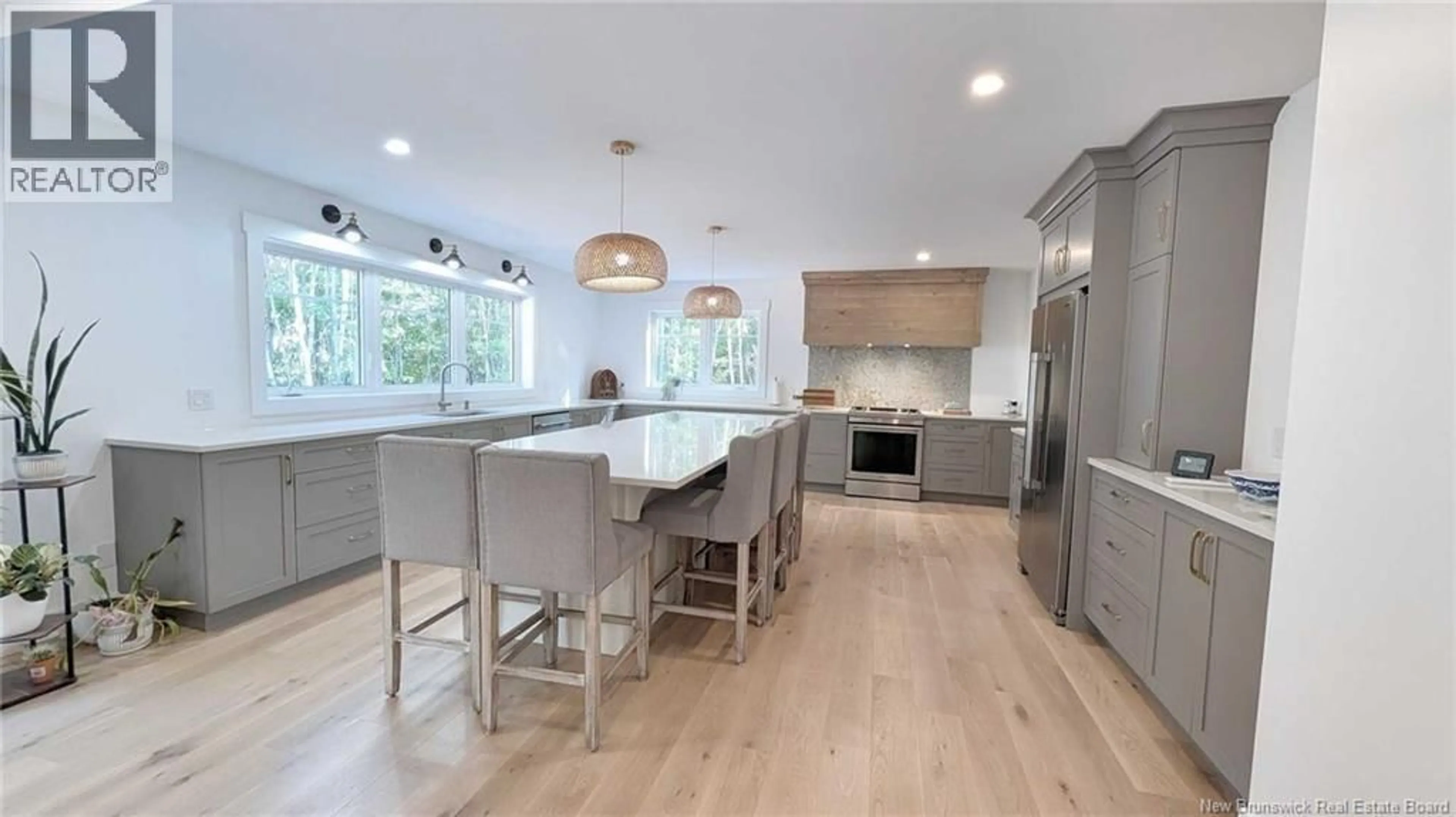 Open concept kitchen, wood/laminate floor for 10858 NB 11, Pokemouche New Brunswick E8P1H6