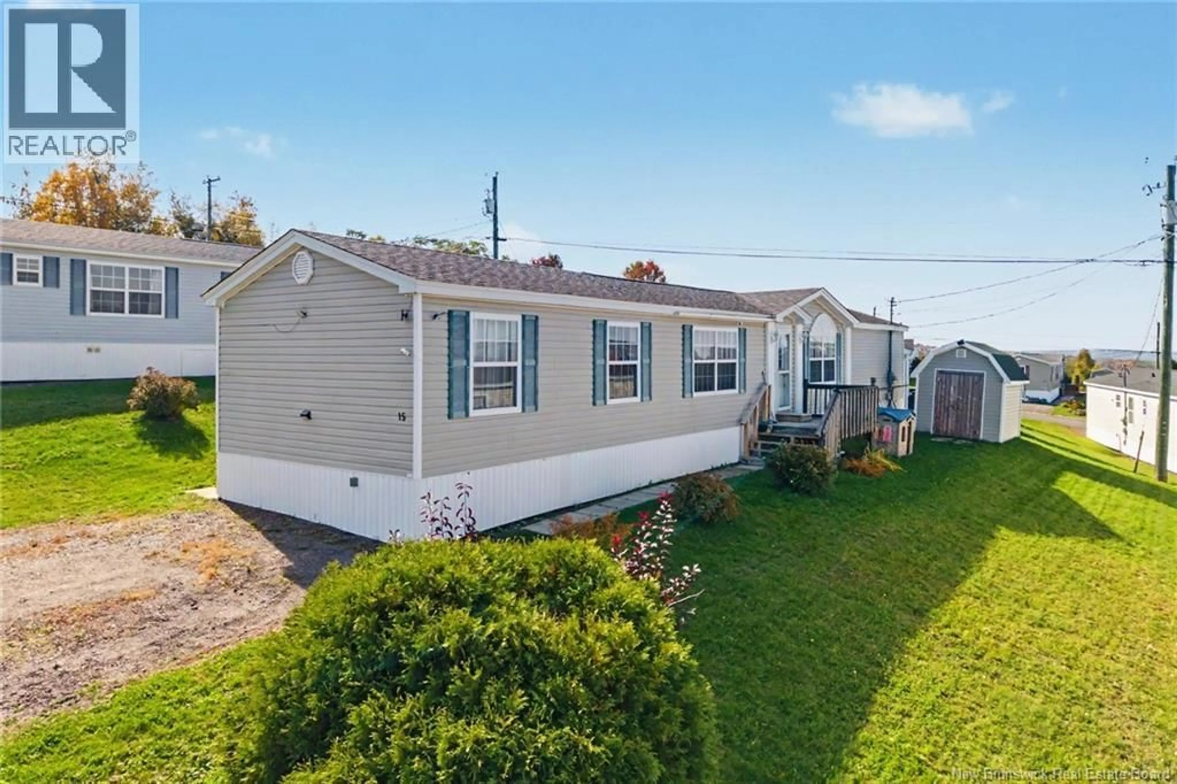 Home with vinyl exterior material, street for 15 SENATOR DRIVE, Fredericton New Brunswick E3C1L8