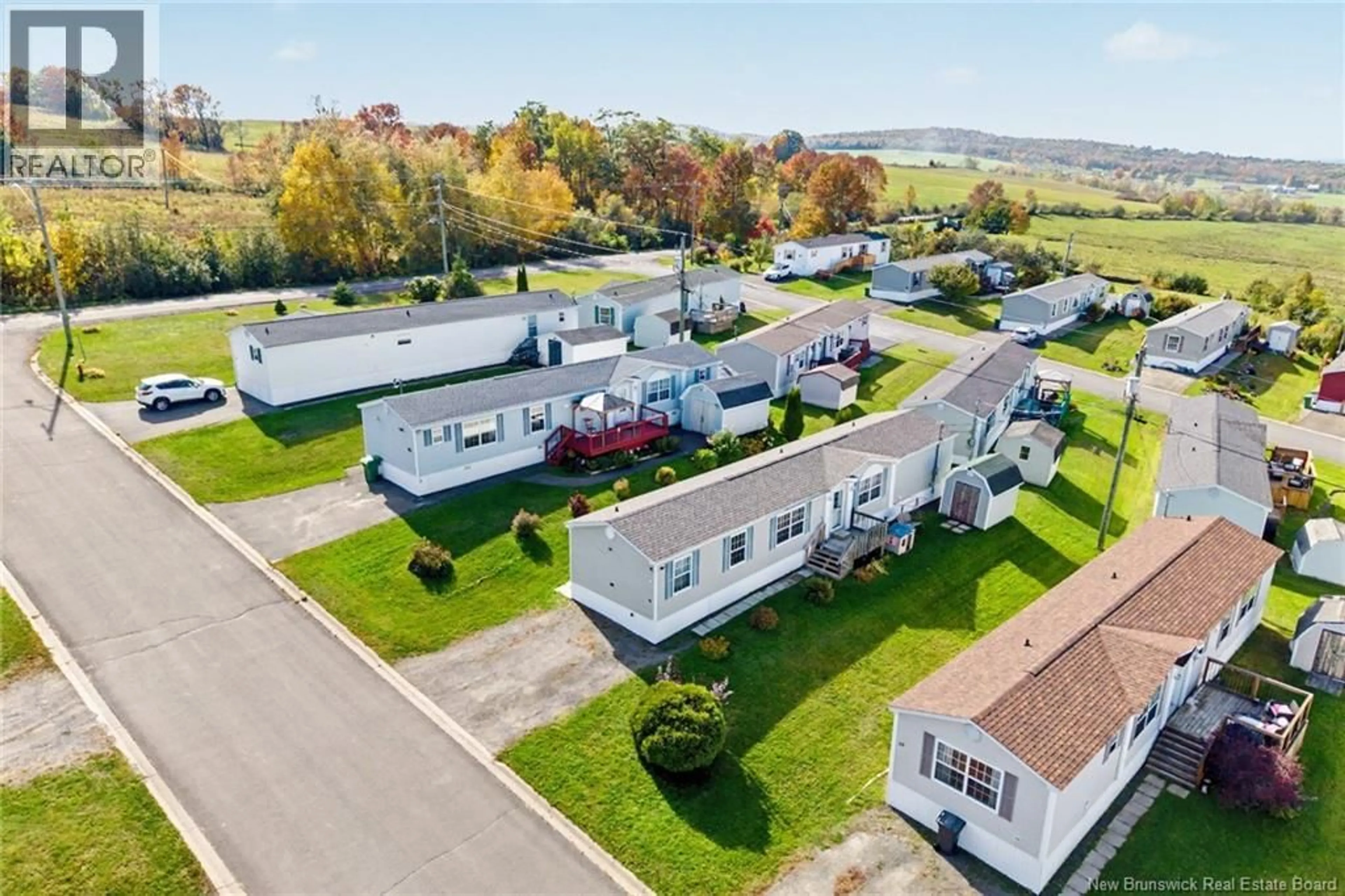 A pic from outside/outdoor area/front of a property/back of a property/a pic from drone, street for 15 SENATOR DRIVE, Fredericton New Brunswick E3C1L8