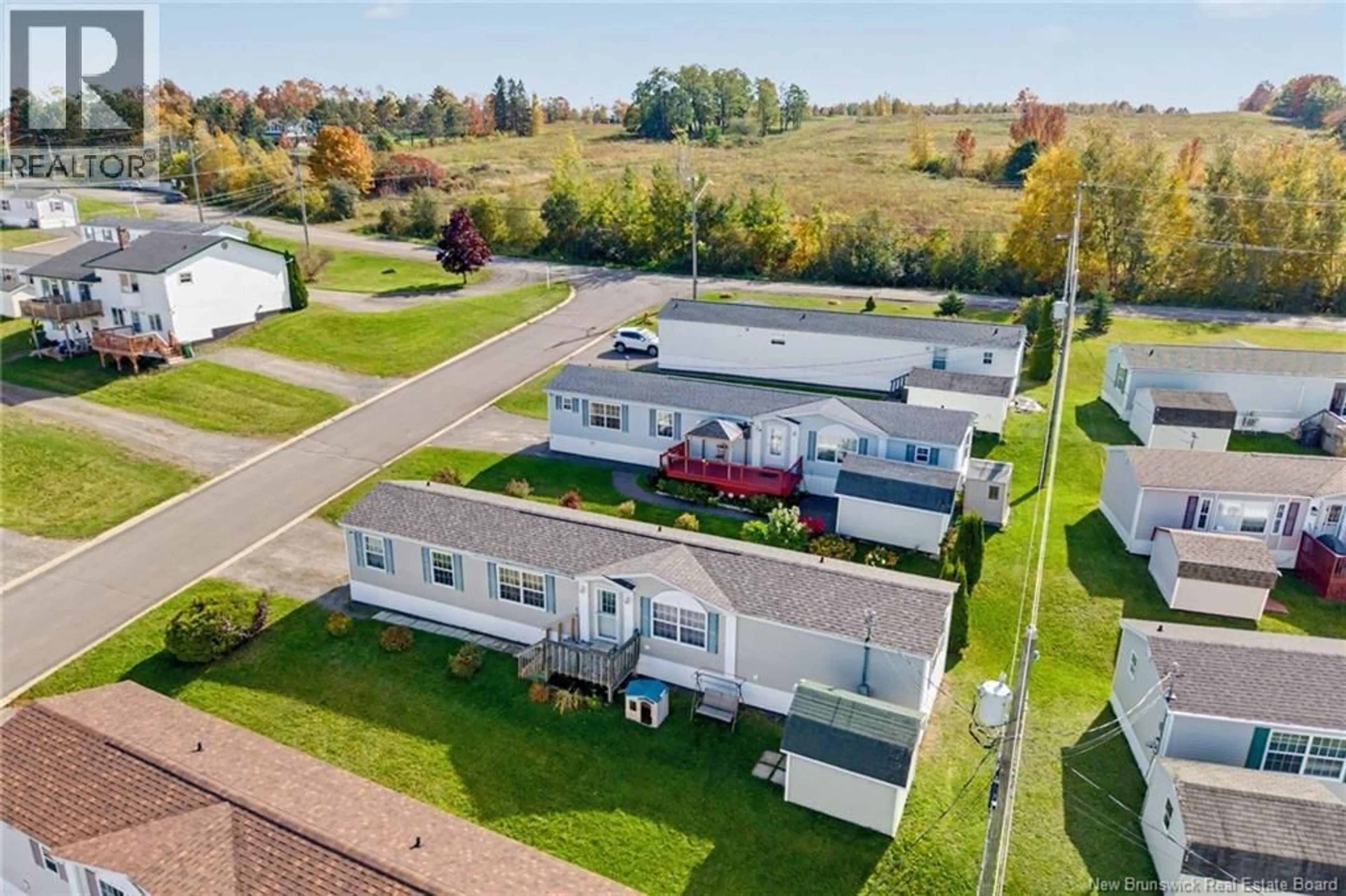 A pic from outside/outdoor area/front of a property/back of a property/a pic from drone, unknown for 15 SENATOR DRIVE, Fredericton New Brunswick E3C1L8