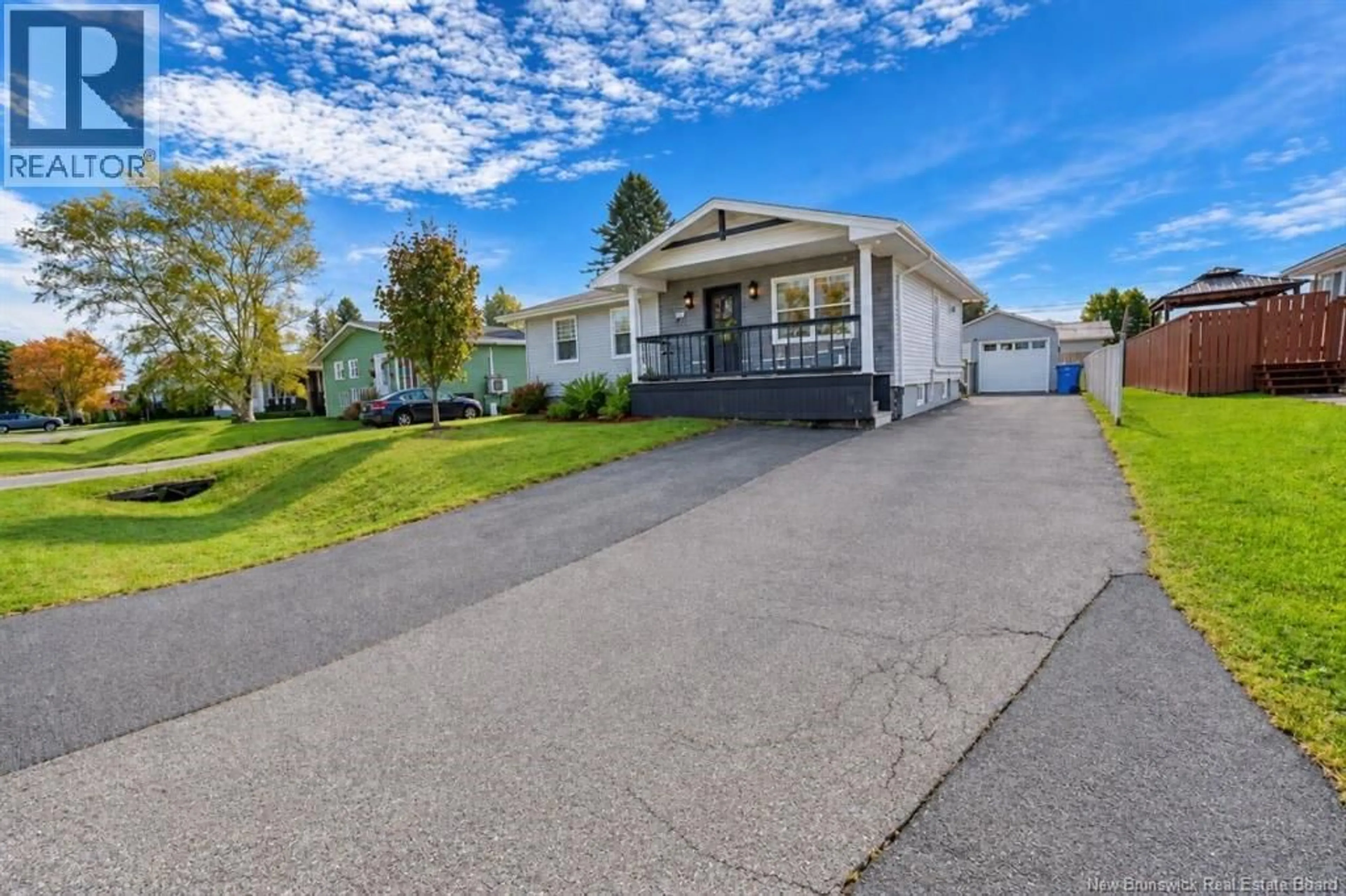 Home with vinyl exterior material, street for 1073 ROCKLAND DRIVE, Bathurst New Brunswick E2A3T8