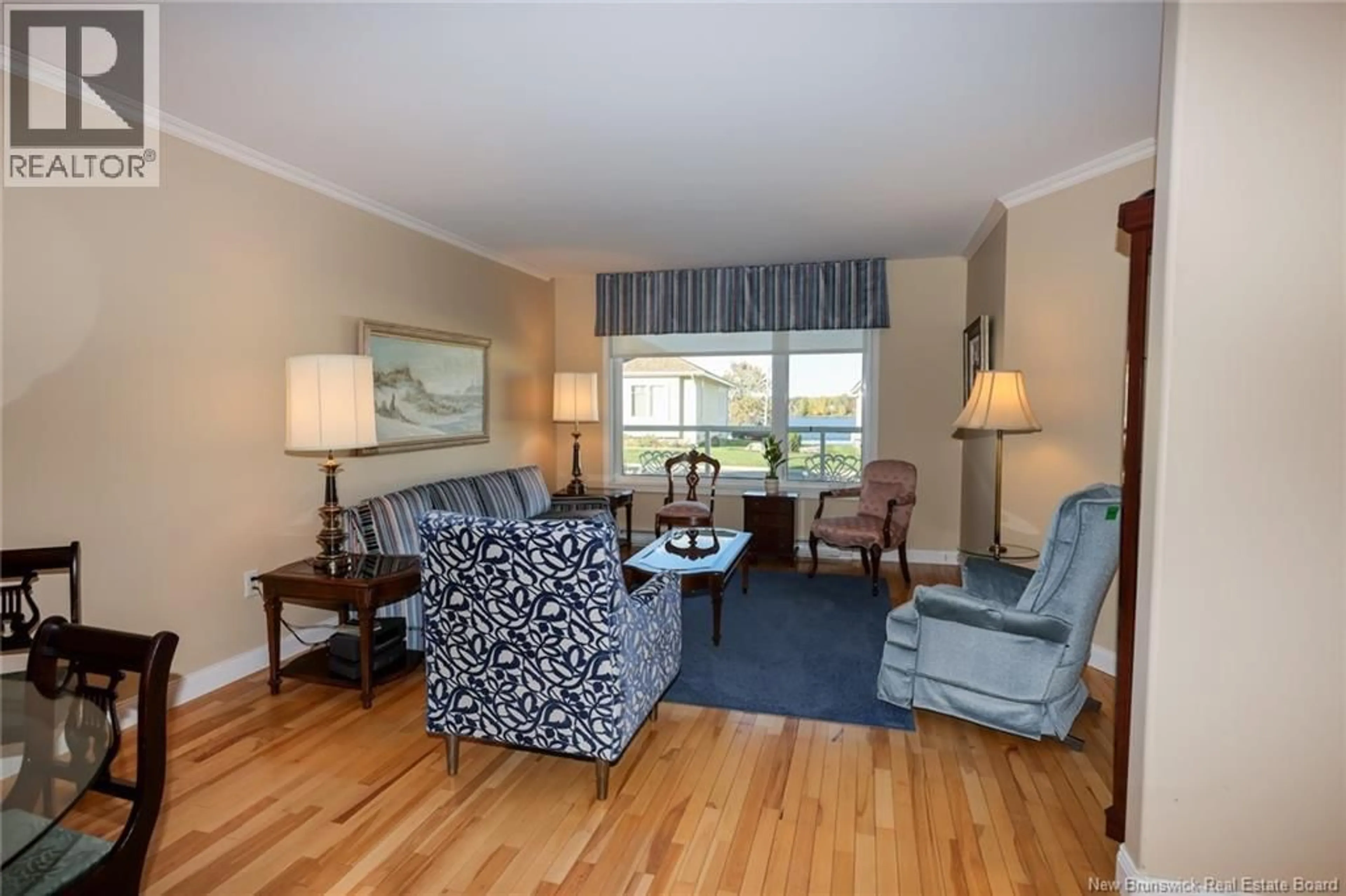 Living room with furniture, wood/laminate floor for 147 ARBOUR BROOK LANE, Fredericton New Brunswick E3B0C5