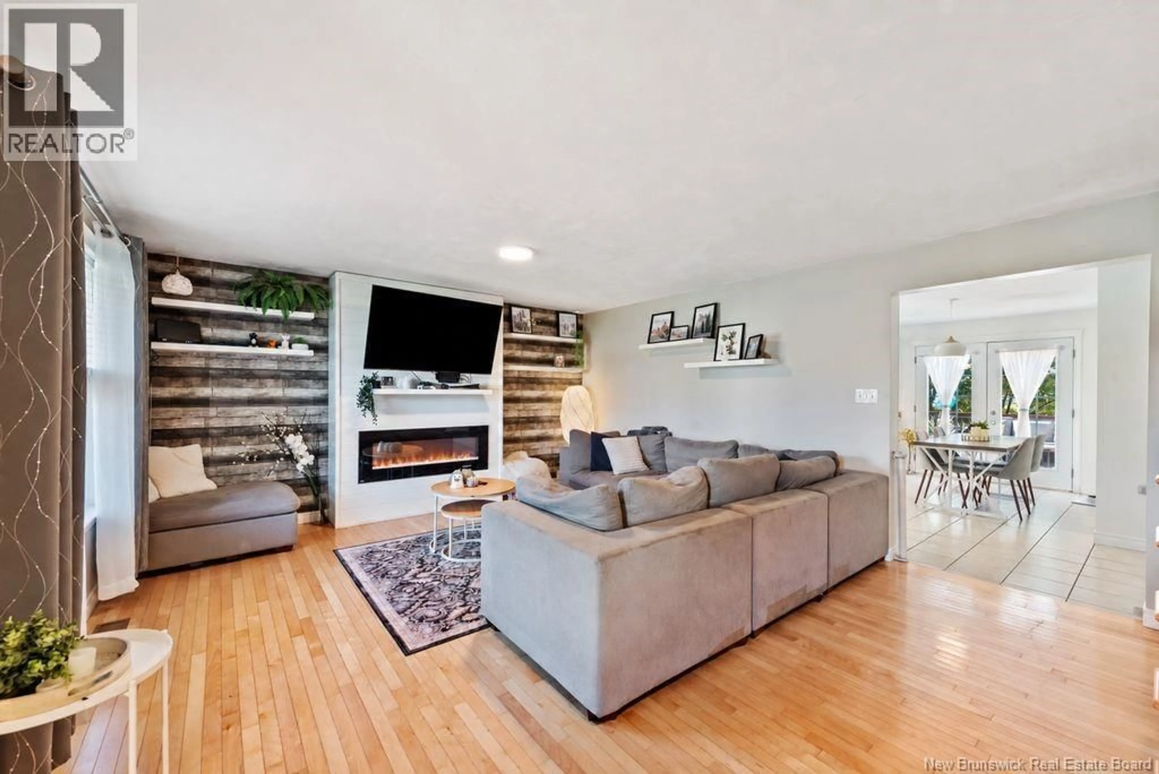 Living room with furniture, wood/laminate floor for 20 WILDERNESS COURT, Moncton New Brunswick E1G0H4