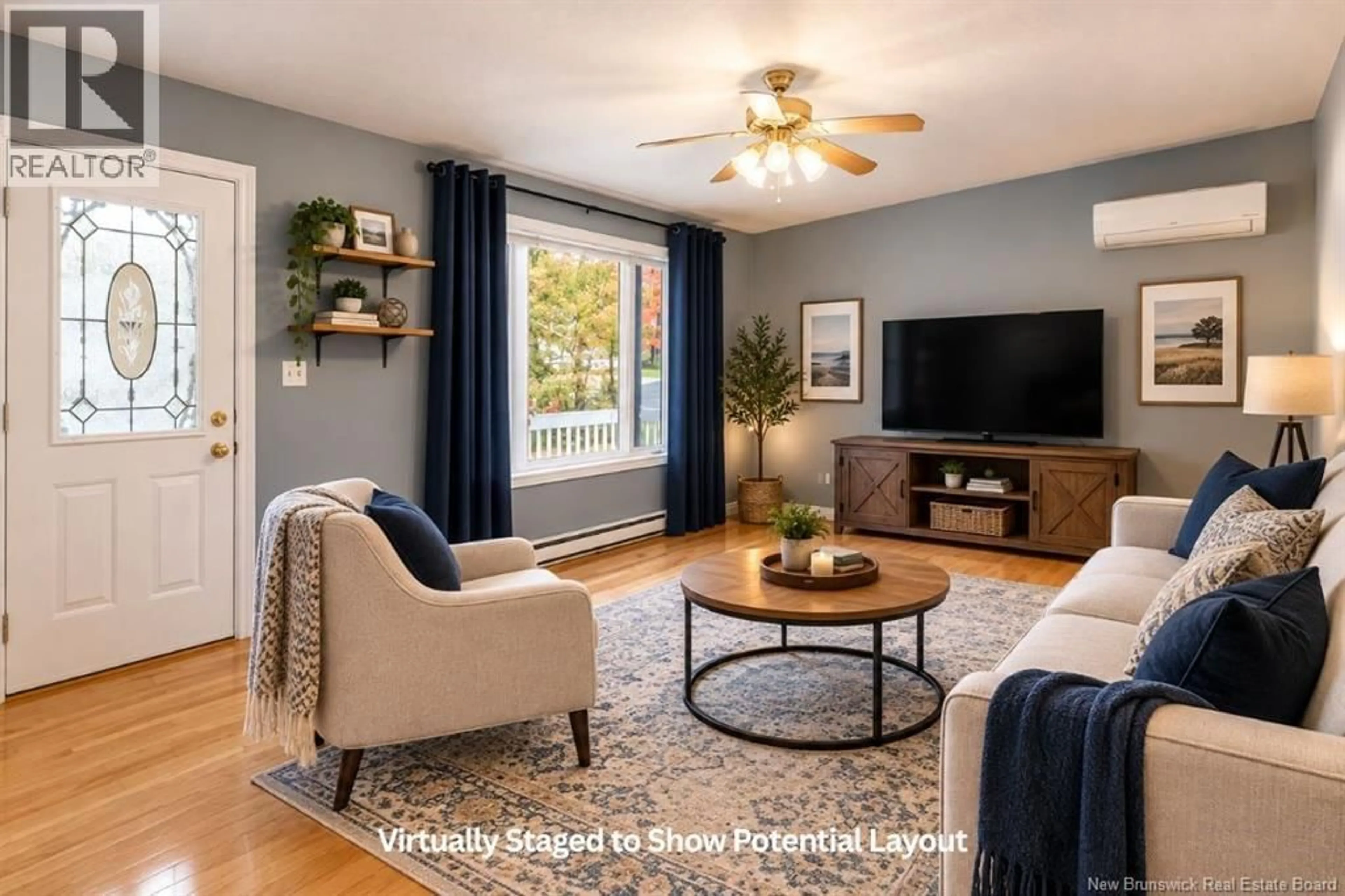 Living room with furniture, wood/laminate floor for 413 MANDEVILLE STREET, Dieppe New Brunswick E1A6W1