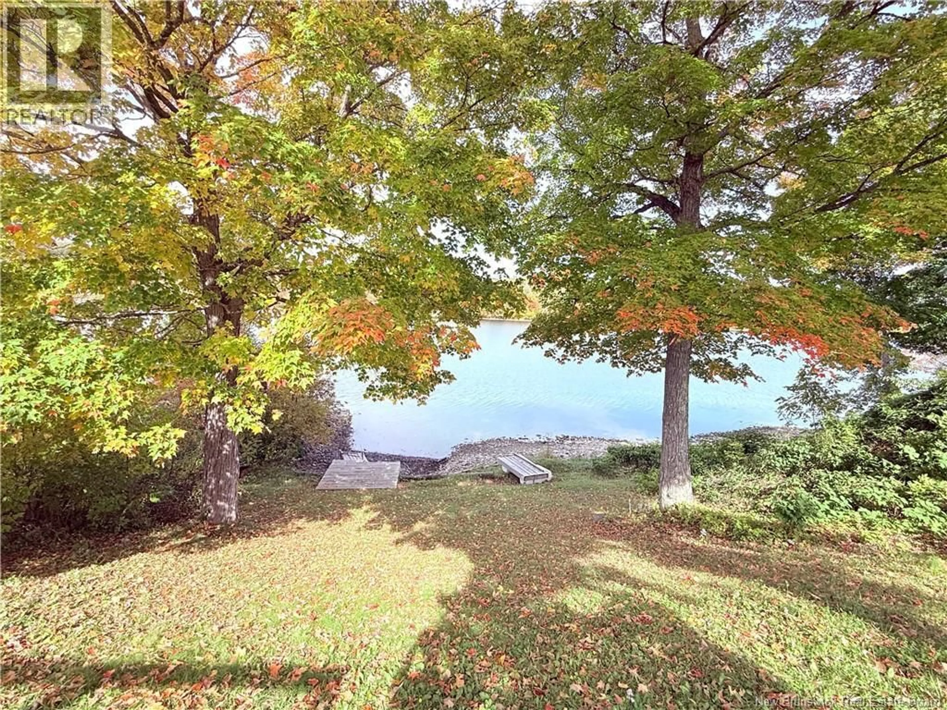 A pic from outside/outdoor area/front of a property/back of a property/a pic from drone, water/lake/river/ocean view for 55 MAIN STREET, Meductic New Brunswick E6H1E3