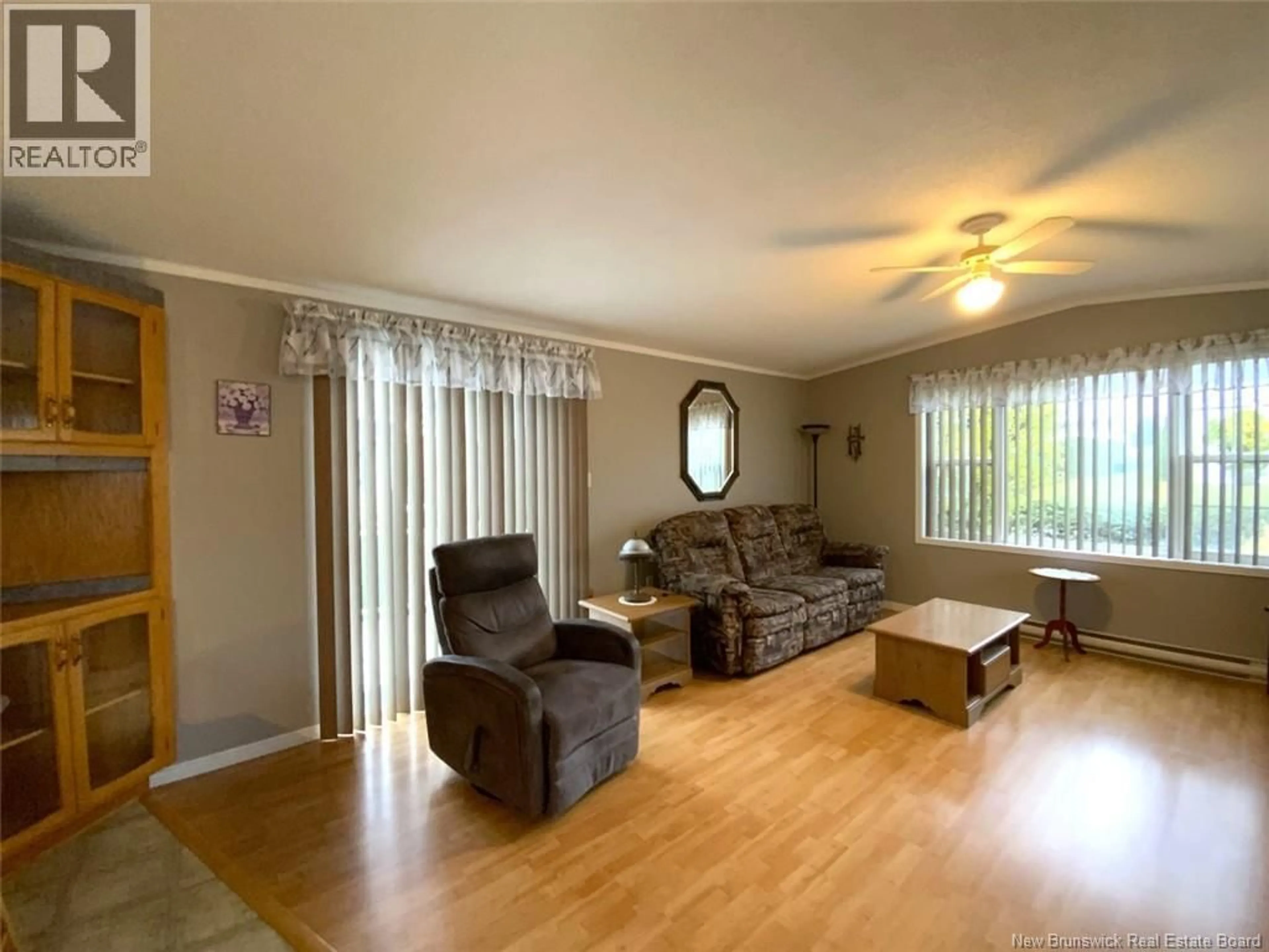 Living room with furniture, wood/laminate floor for 13 DU BOULEAU STREET, Saint-Jacques New Brunswick E7B1R7