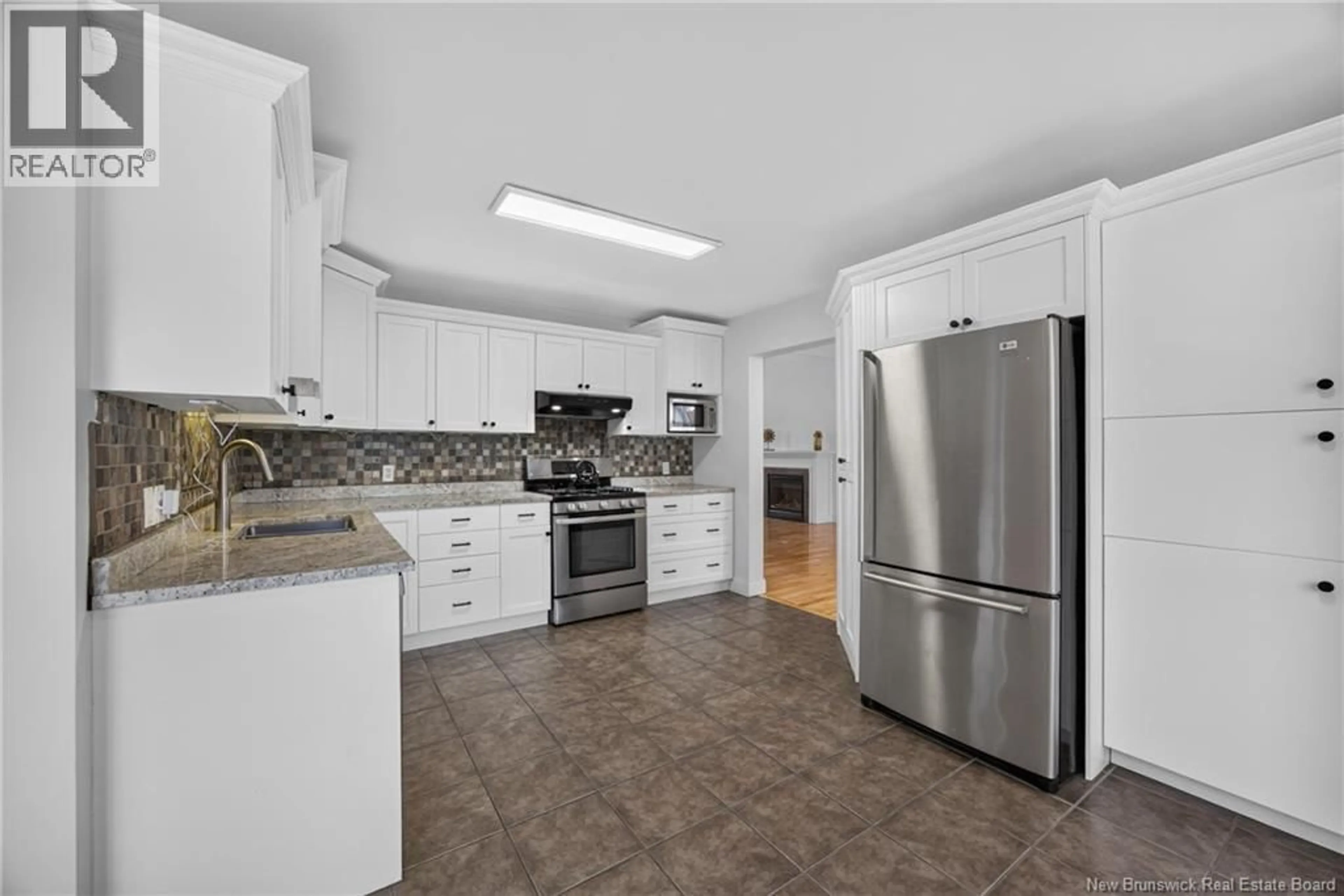 Open concept kitchen, ceramic/tile floor for 15 HARLAND COURT, Fredericton New Brunswick E3B0E3