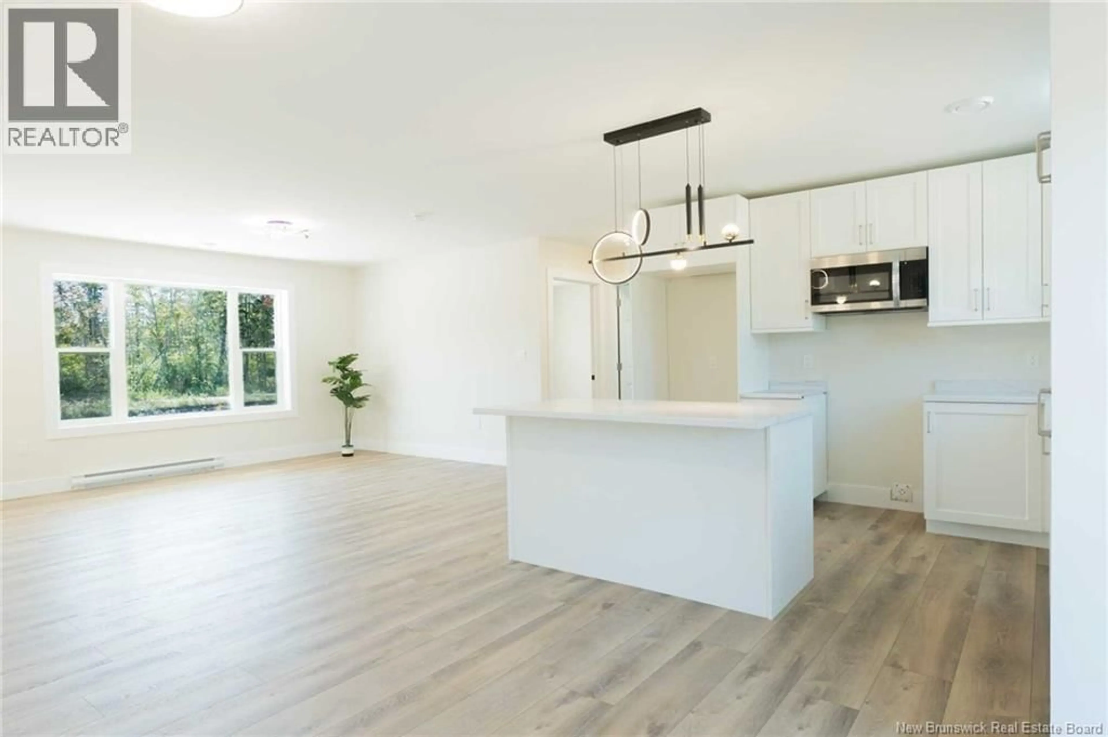 Open concept kitchen, wood/laminate floor for 521 CHEM. WARD ROAD, Bouctouche New Brunswick E4S4A8