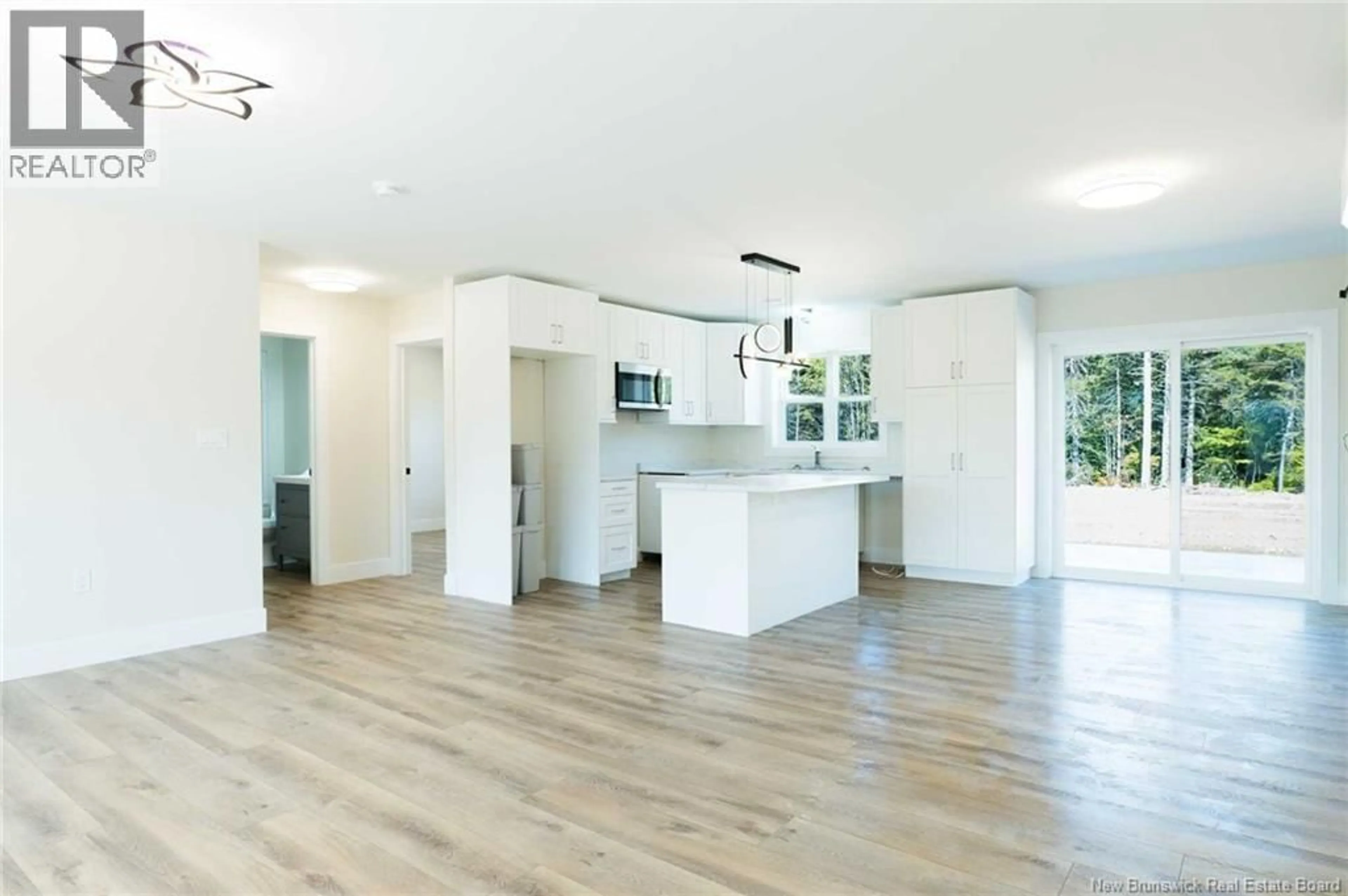Open concept kitchen, wood/laminate floor for 521 CHEM. WARD ROAD, Bouctouche New Brunswick E4S4A8