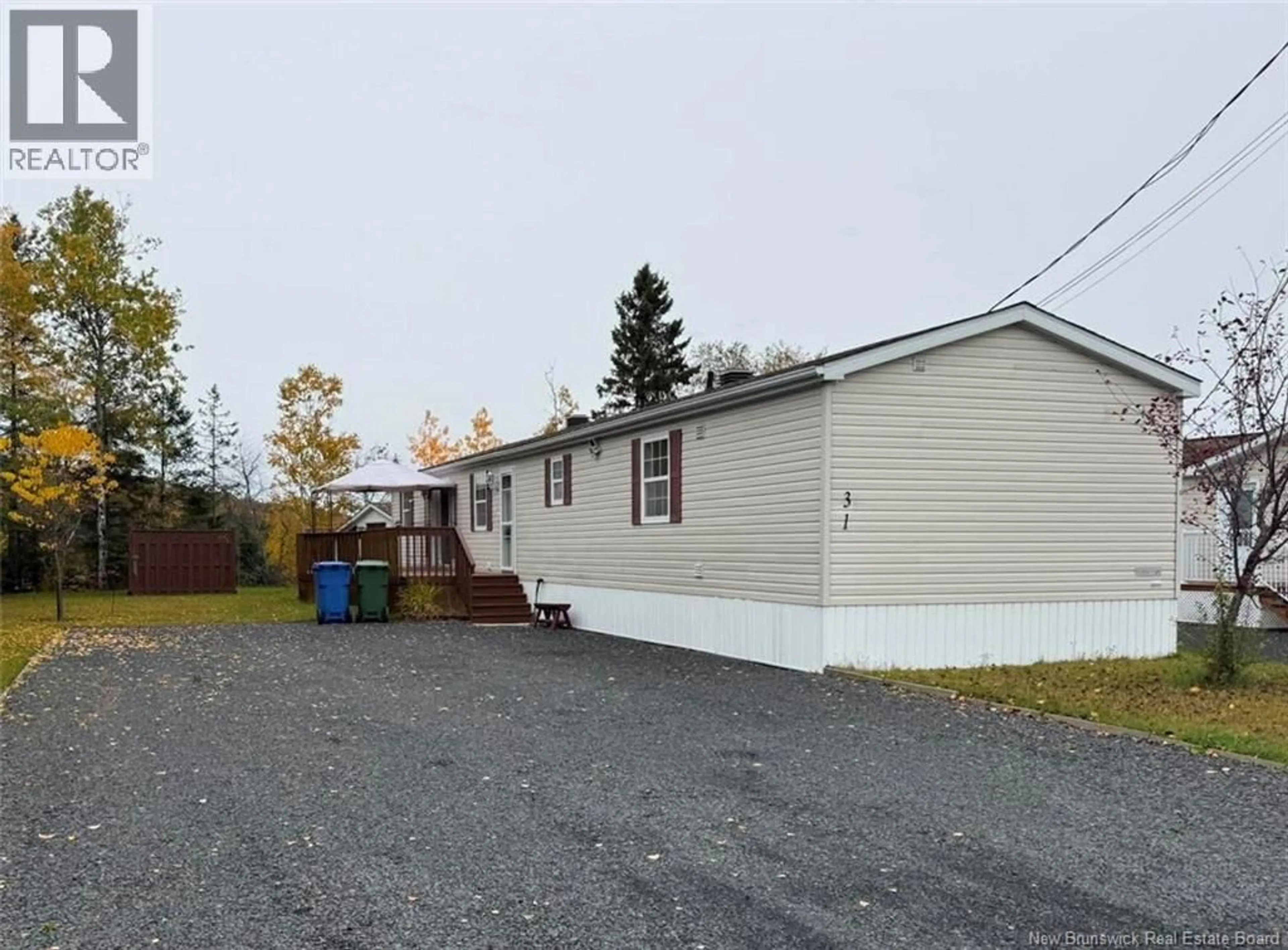 Home with vinyl exterior material, street for 31 LOMBARDIE STREET, Saint-Jacques New Brunswick E7B2X8