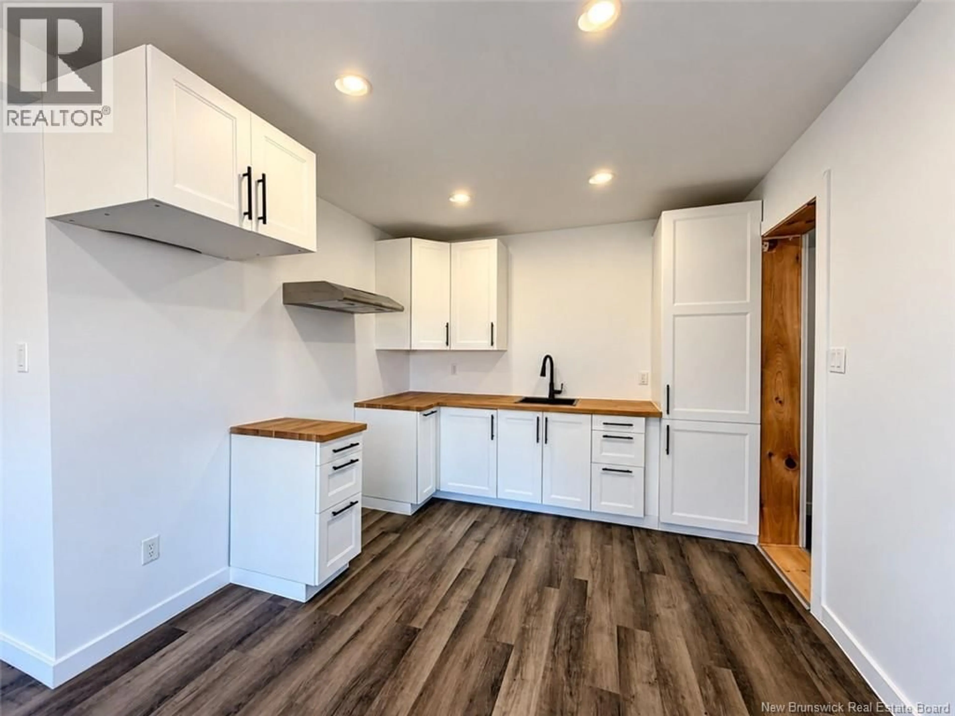 Open concept kitchen, wood/laminate floor for 162 FERGUSON STREET, Atholville New Brunswick E3N4T6