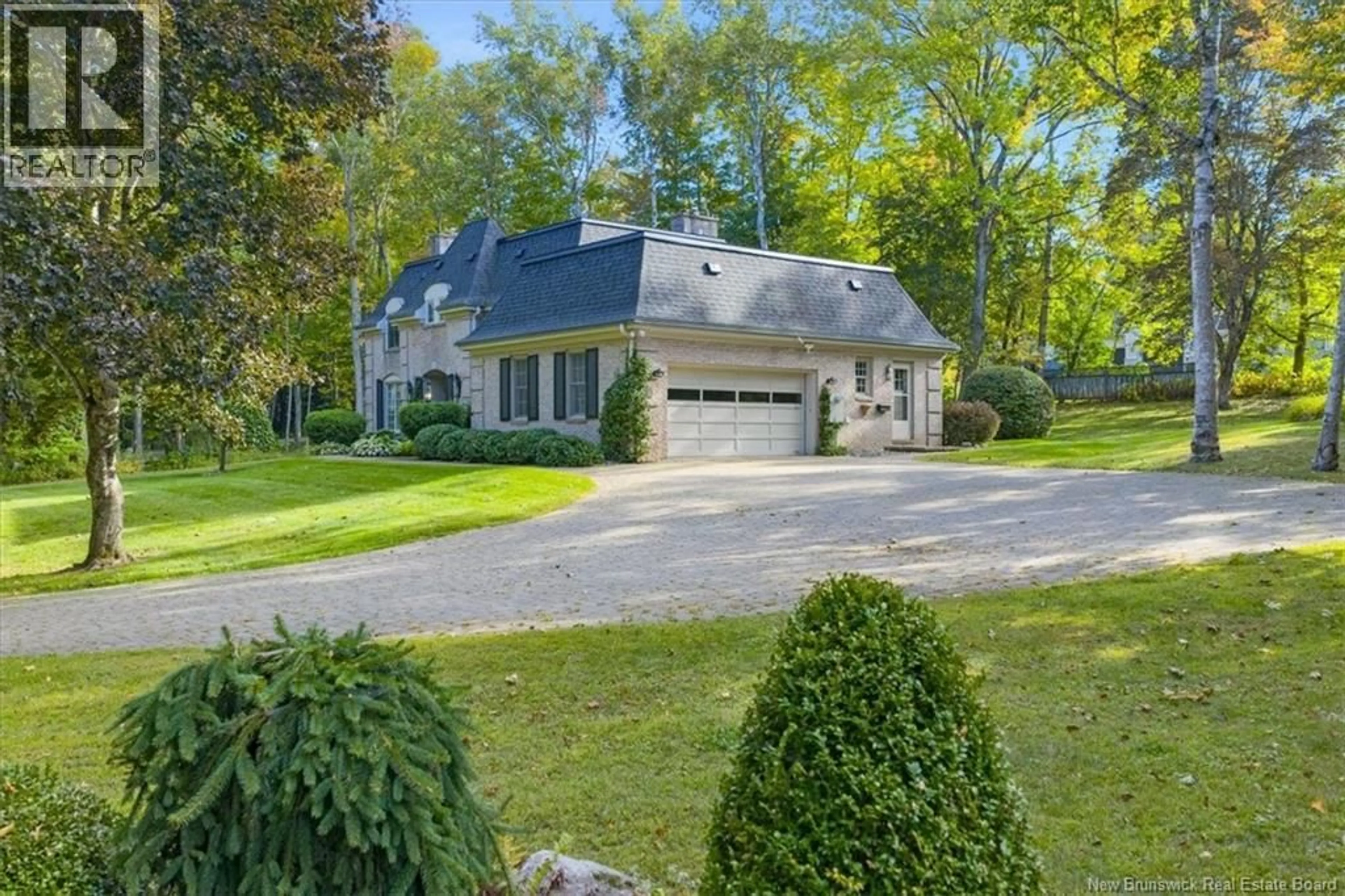 A pic from outside/outdoor area/front of a property/back of a property/a pic from drone, street for 65 WILDWOOD LANE, Fredericton New Brunswick E3B5Z2