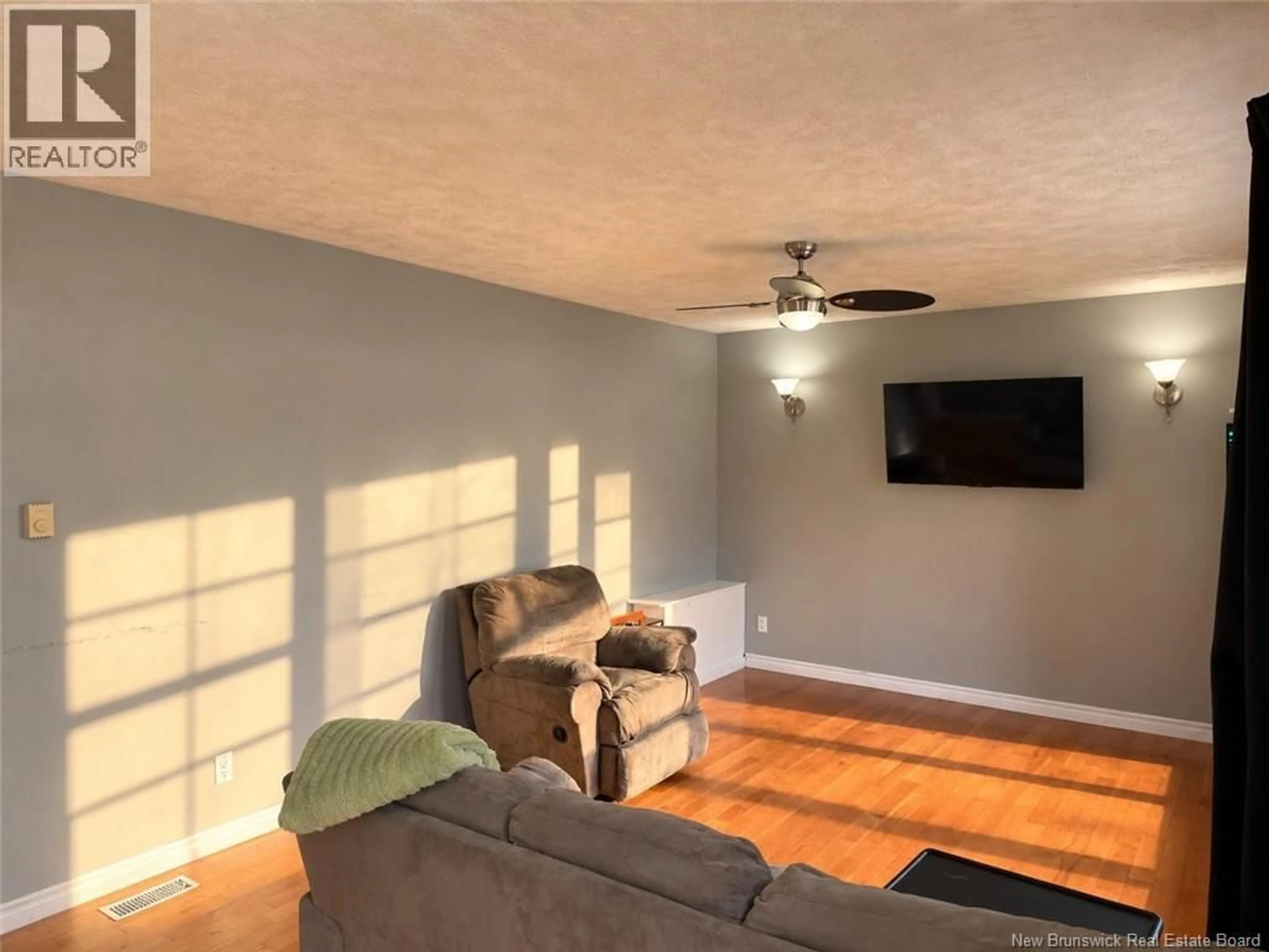 Living room with furniture, wood/laminate floor for 15 BIRD STREET, Nackawic New Brunswick E6G1B9