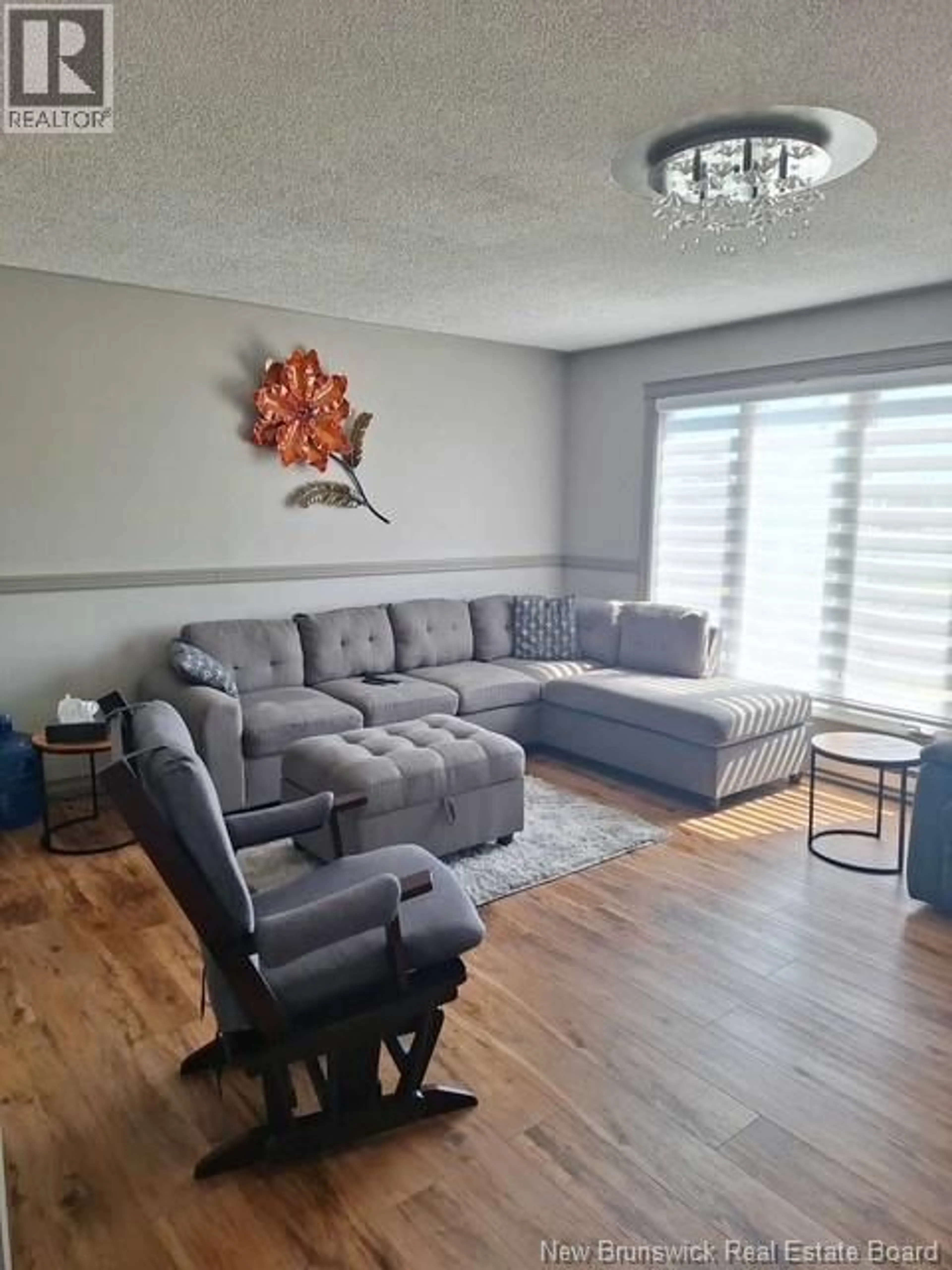 Living room with furniture, wood/laminate floor for 4915 ROUTE 11, Brantville New Brunswick E9H1M3