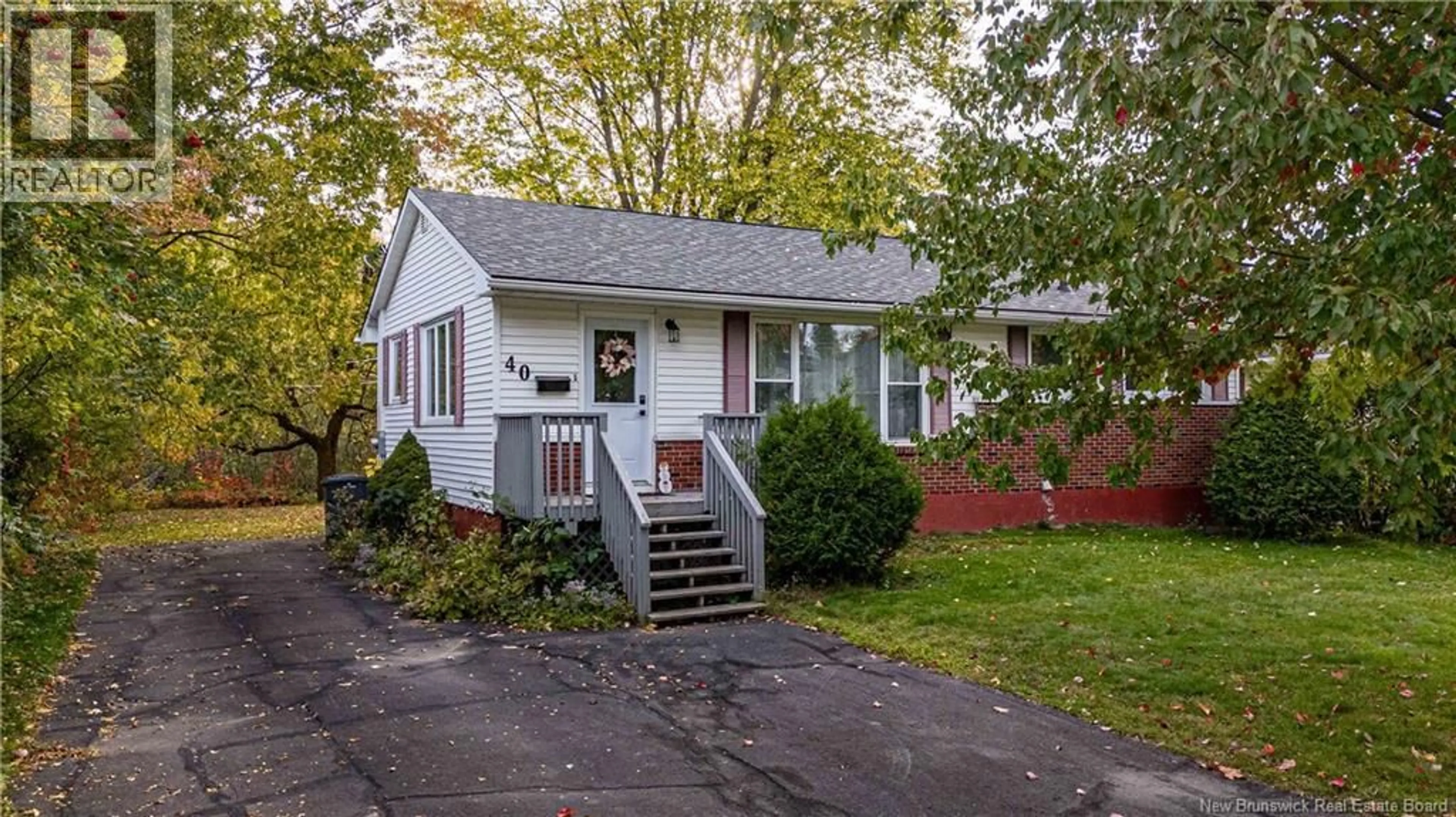 Home with vinyl exterior material, street for 40 HILLCOURT DRIVE, Fredericton New Brunswick E3A1S1