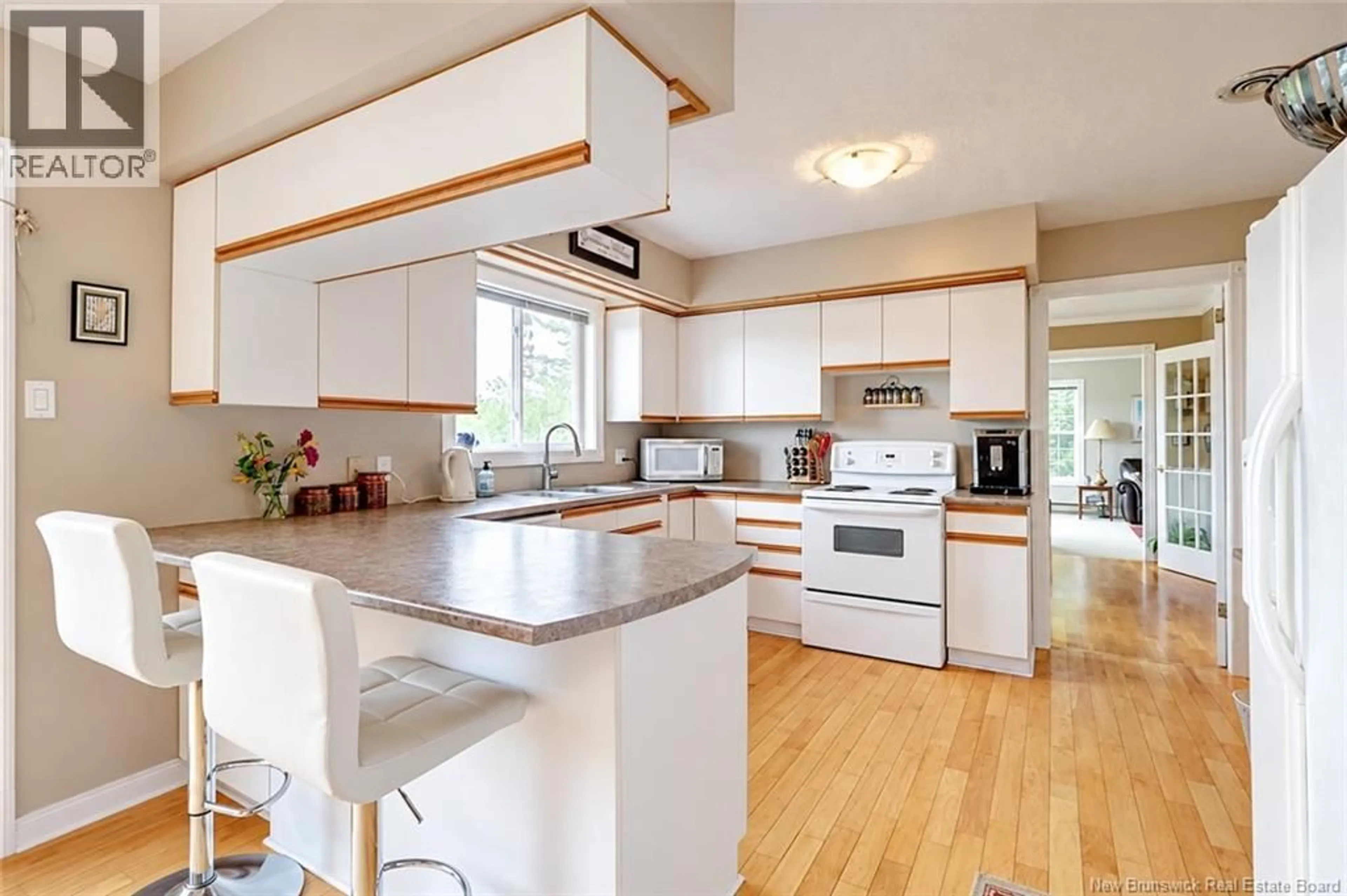 Open concept kitchen, wood/laminate floor for 18 HILLVIEW STREET, Upper Kingsclear New Brunswick E3B1V1