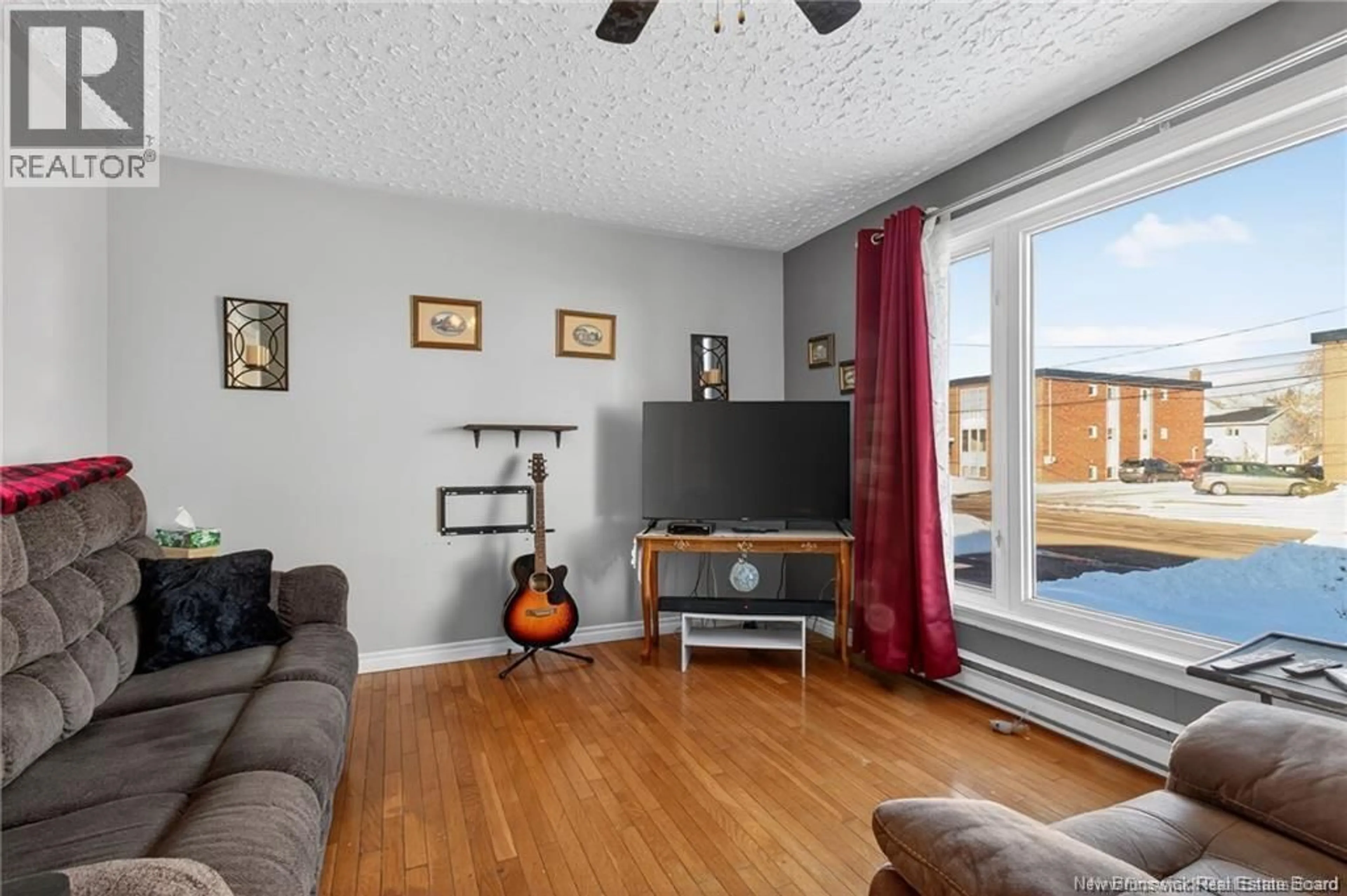 Living room with furniture, wood/laminate floor for 124 REDMOND STREET, Moncton New Brunswick E1A3J7
