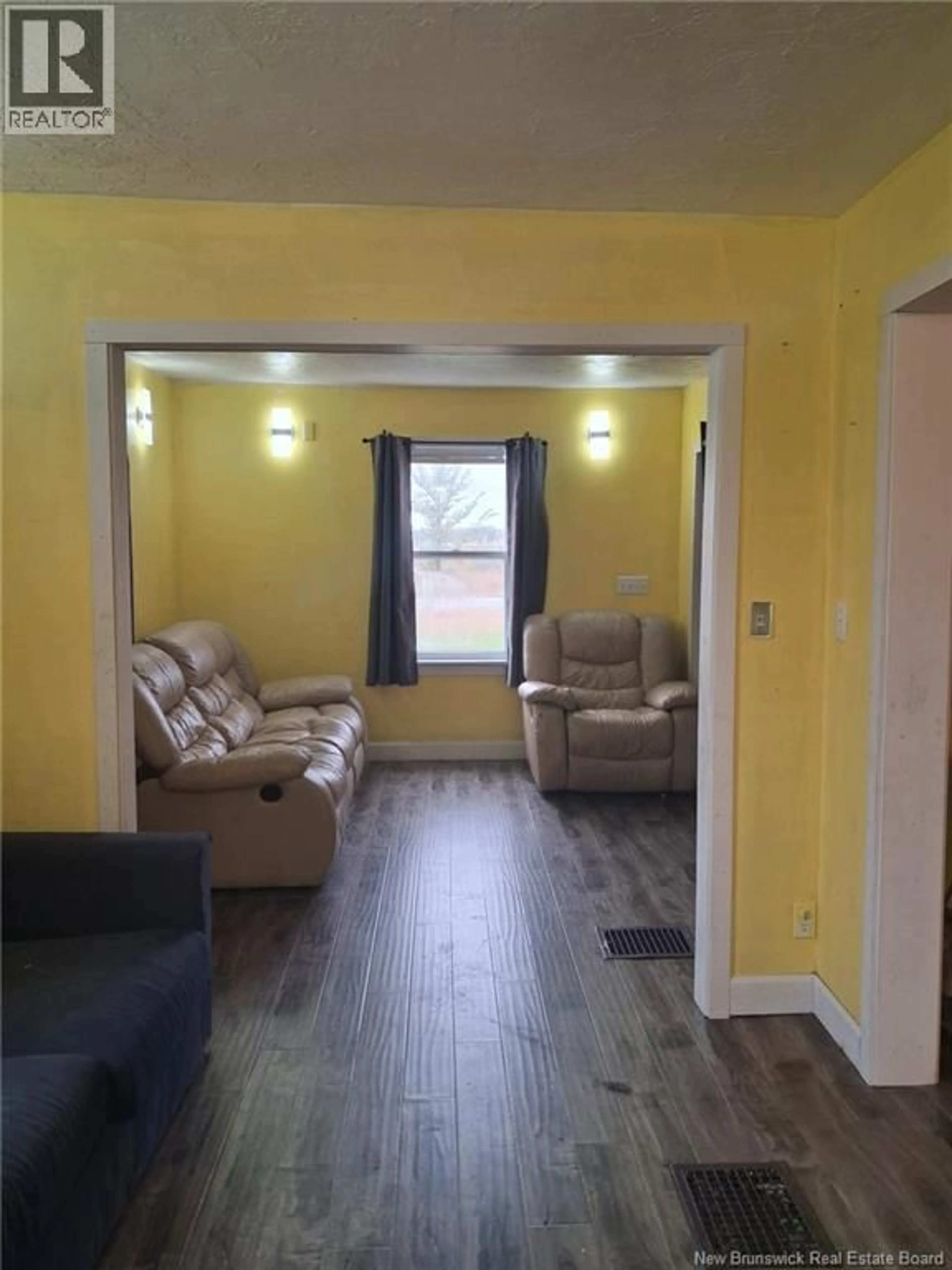 Living room with furniture, wood/laminate floor for 138 MAIN STREET, Blackville New Brunswick E9B1P2